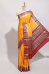 Orange zari motifs design art mysore silk saree with contrast zari border and blouse