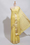 Pale yellow plain design art mysore silk saree with self zari border and matching blouse