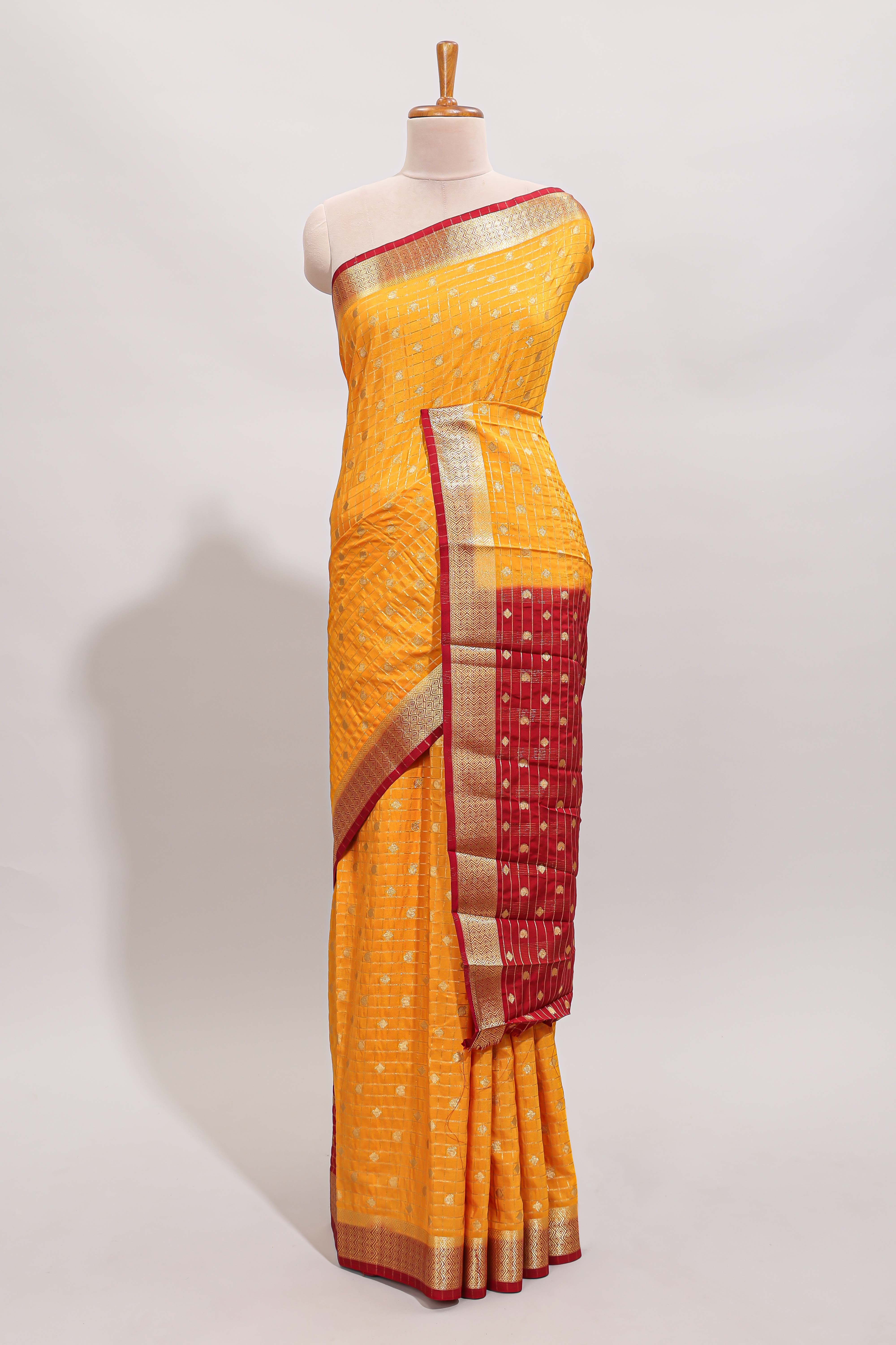 Yellow checked zari motifs design art mysore silk saree with contrast zari border and checked blouse
