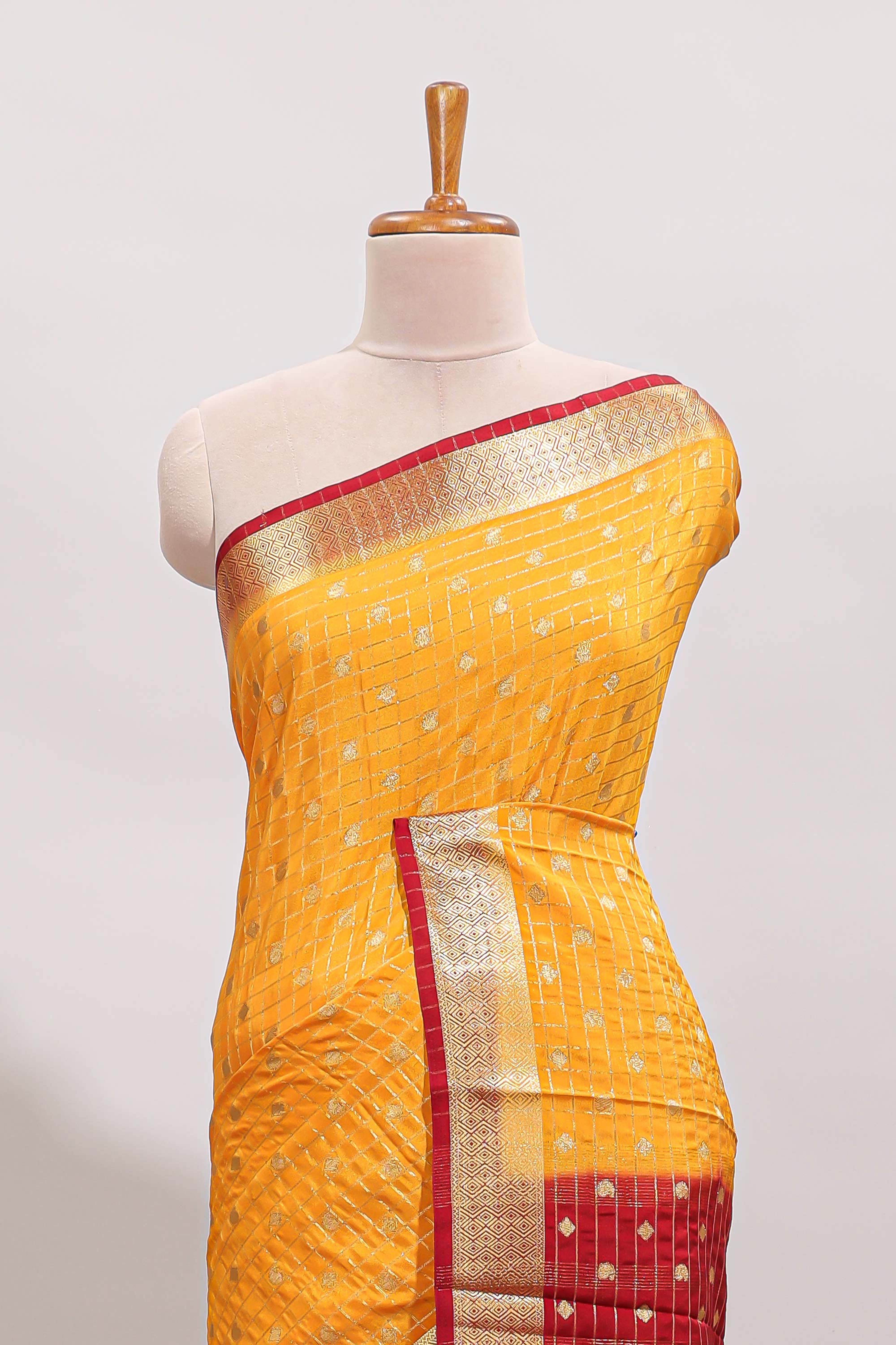 Yellow checked zari motifs design art mysore silk saree with contrast zari border and checked blouse