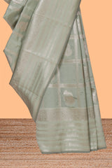 Pale green checked zari motifs art silk saree with self zari border and matching zari motifs blouse