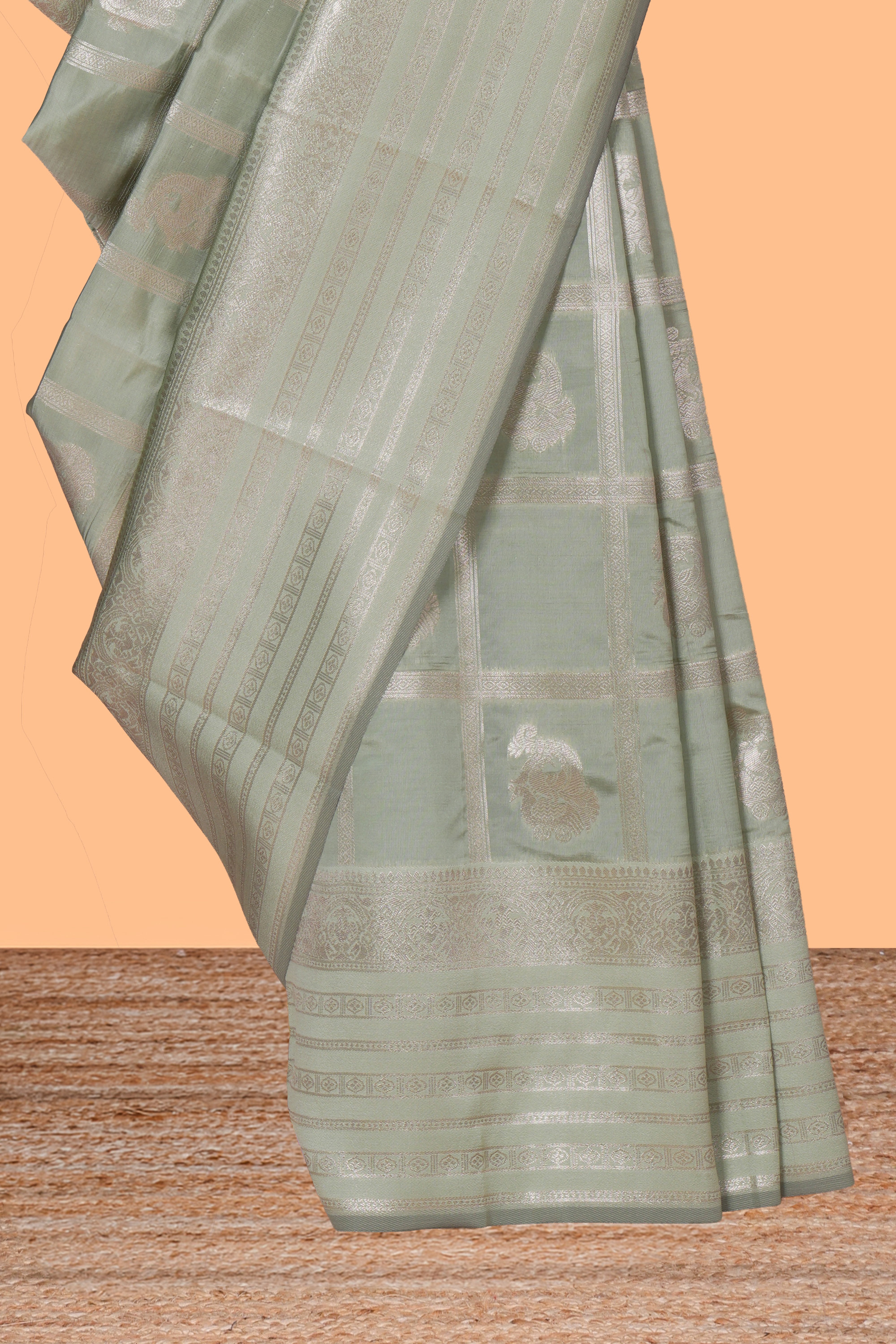 Pale green checked zari motifs art silk saree with self zari border and matching zari motifs blouse