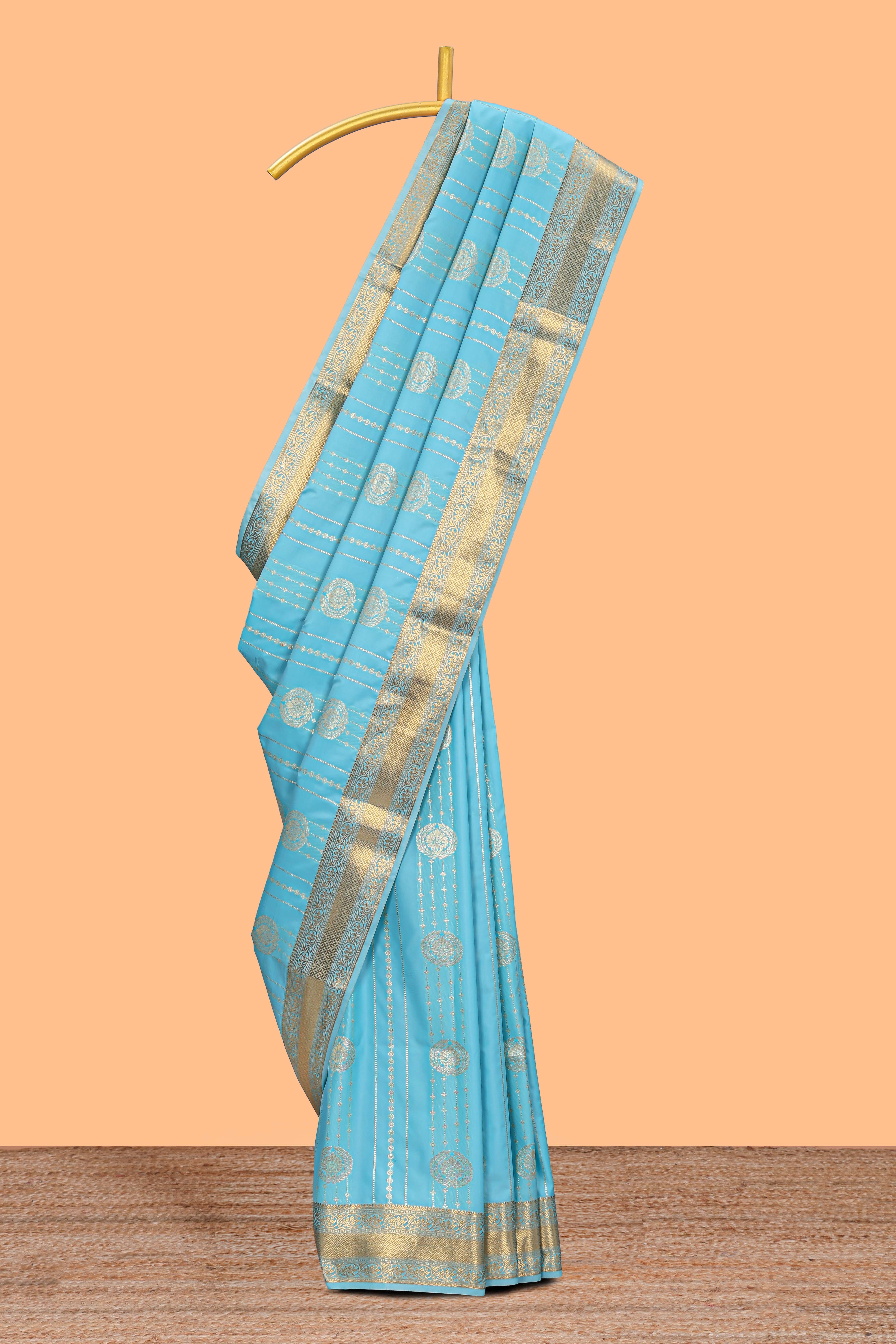 Turquoise blue striped zari motifs art silk saree with self zari border and matching blouse