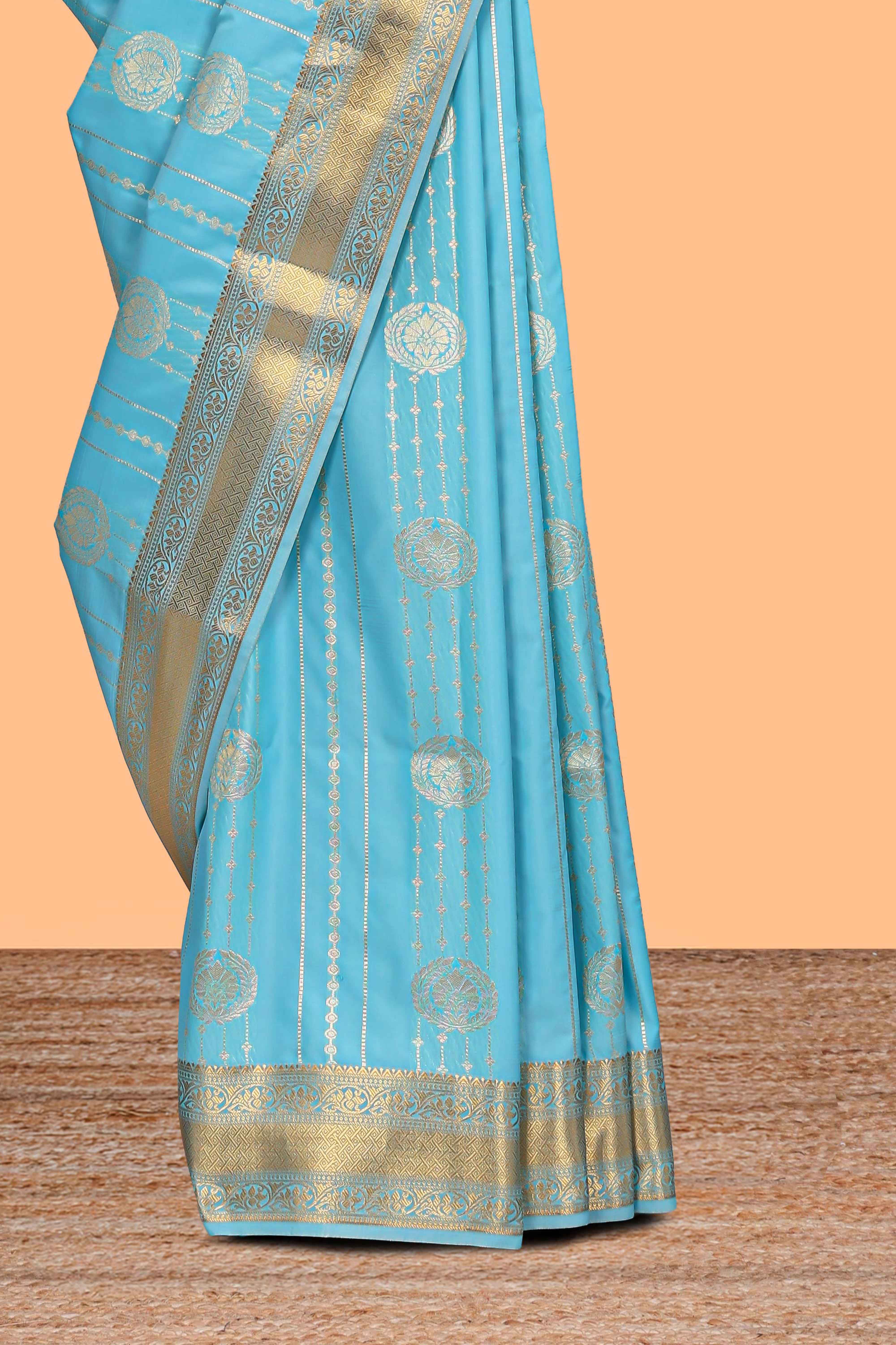 Turquoise blue striped zari motifs art silk saree with self zari border and matching blouse