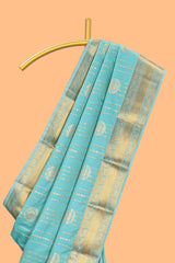 Turquoise green striped zari motifs art silk saree with self zari border and matching blouse