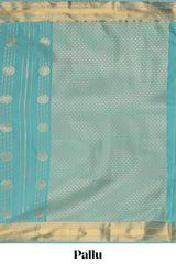 Turquoise green striped zari motifs art silk saree with self zari border and matching blouse