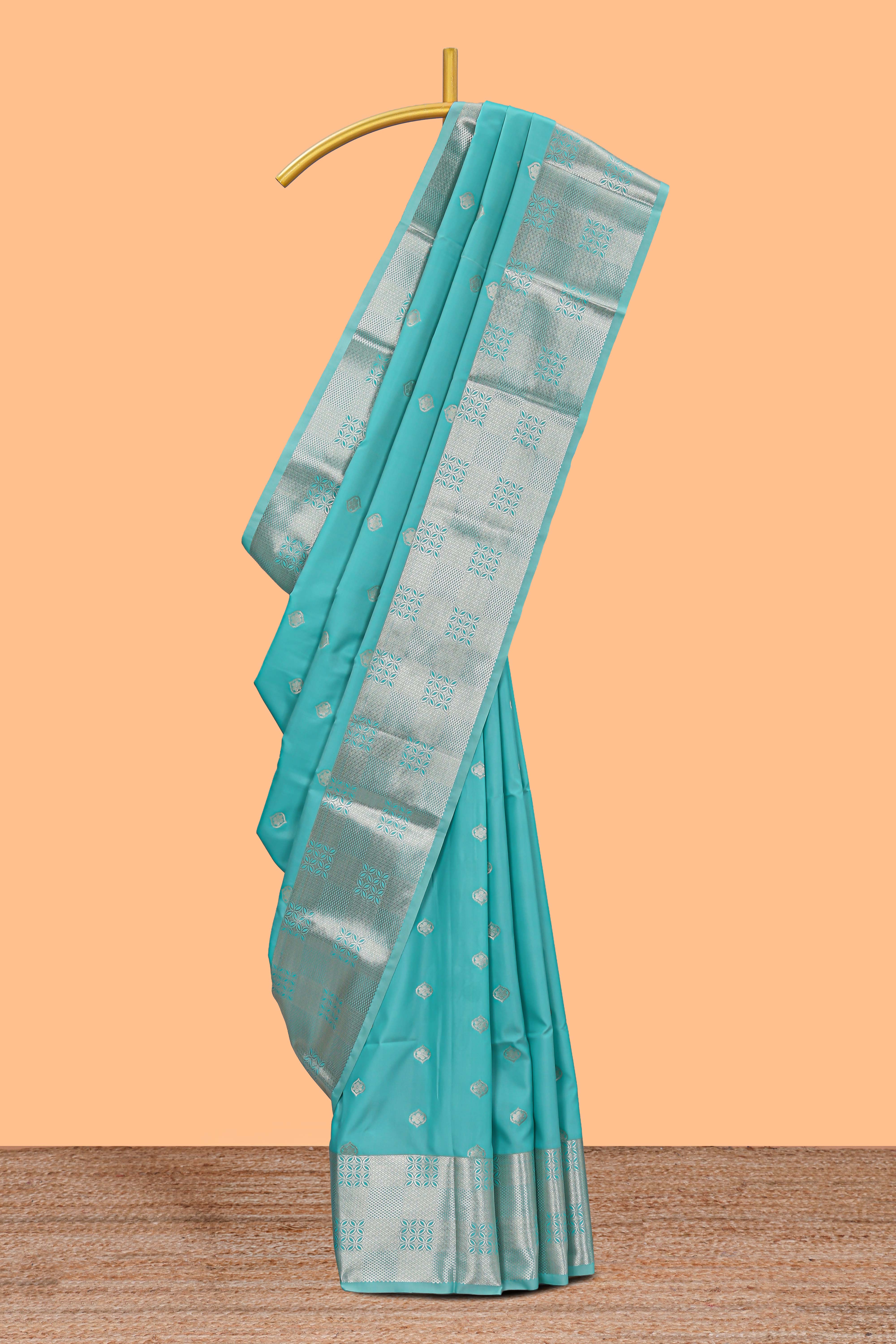 Turquoise blue zari motifs art silk saree with self zari border and matching blouse