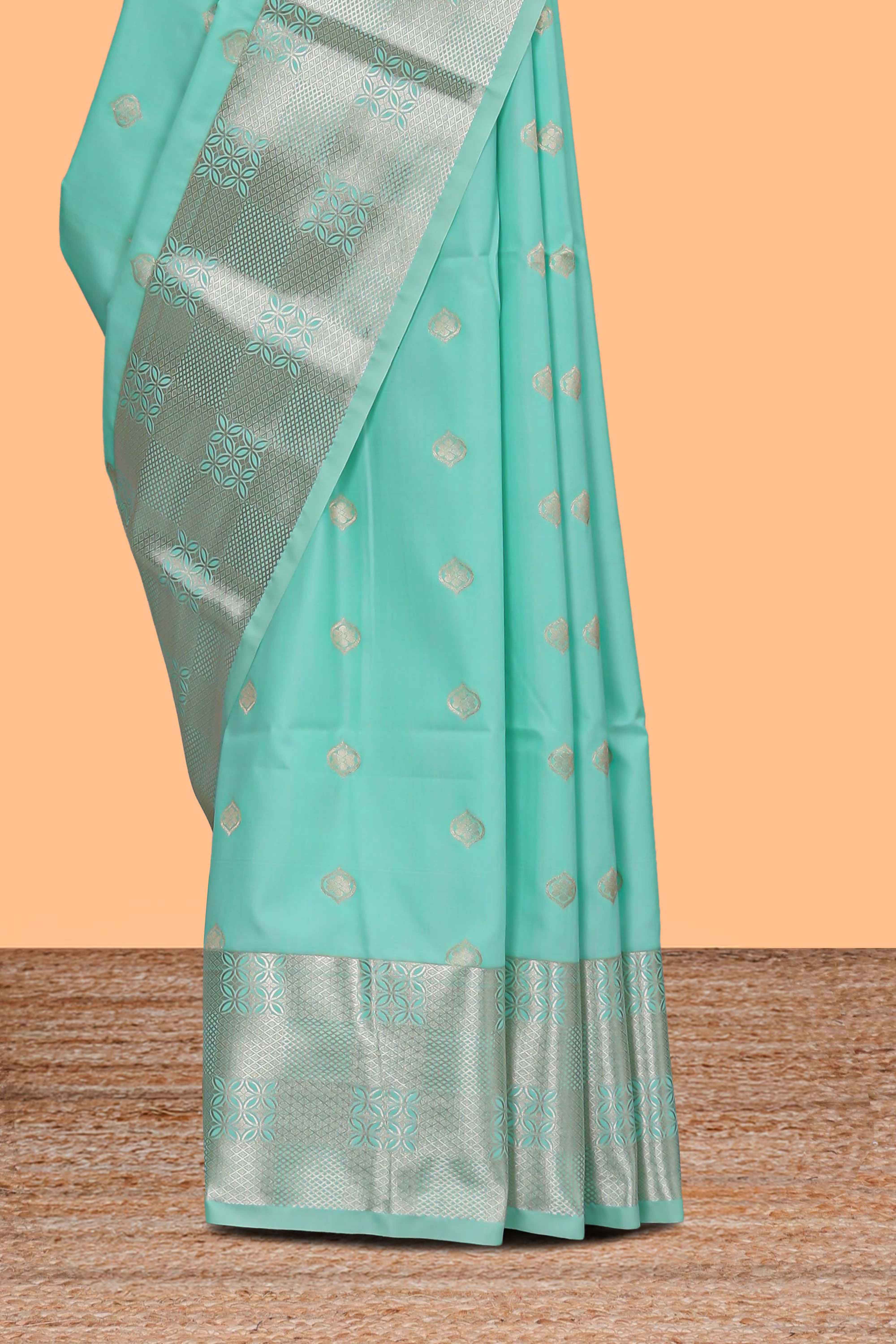 Turquoise green zari motifs art silk saree with self zari border and matching blouse