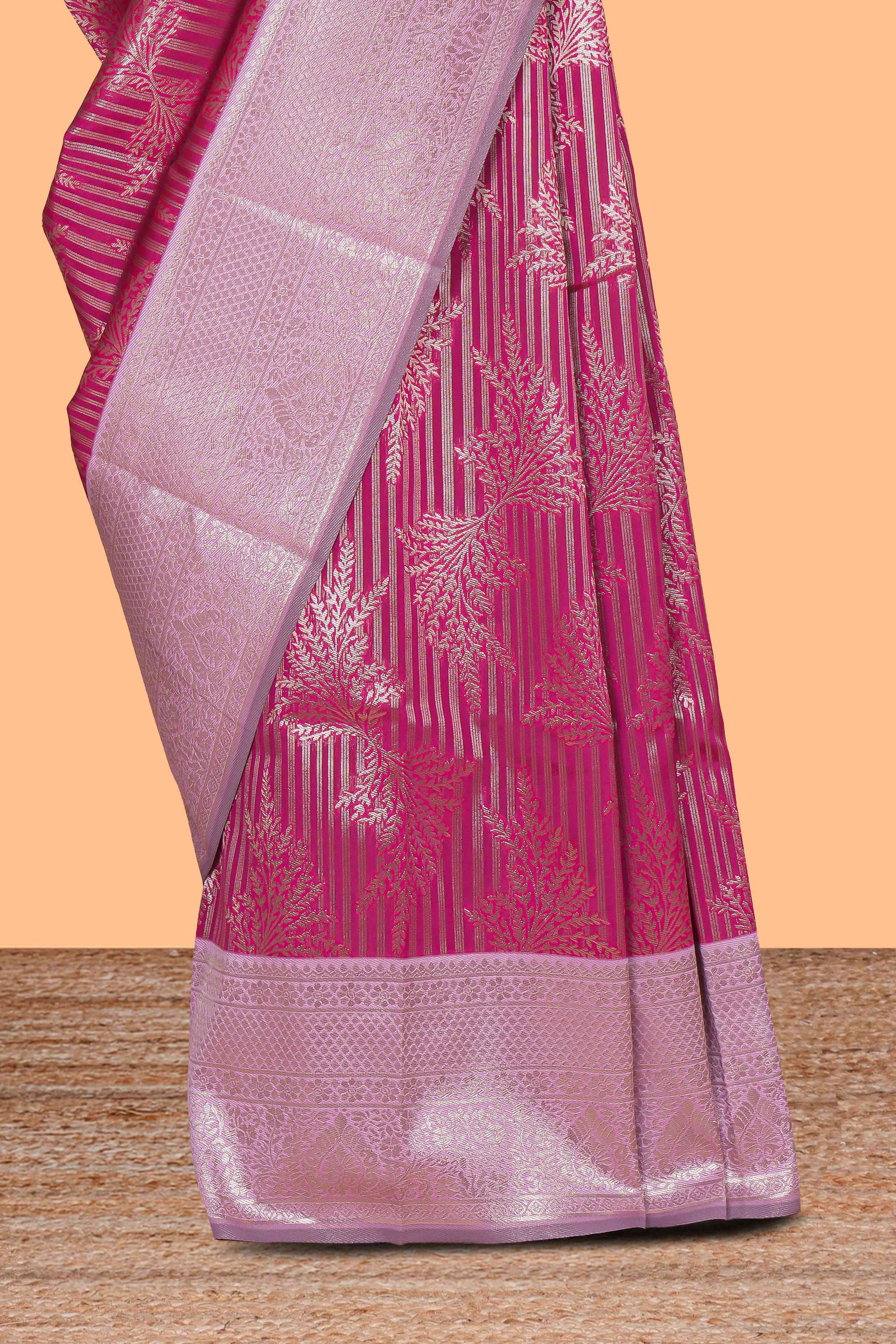Pink striped floral design art silk saree with contrast zari border and zari motifs blouse