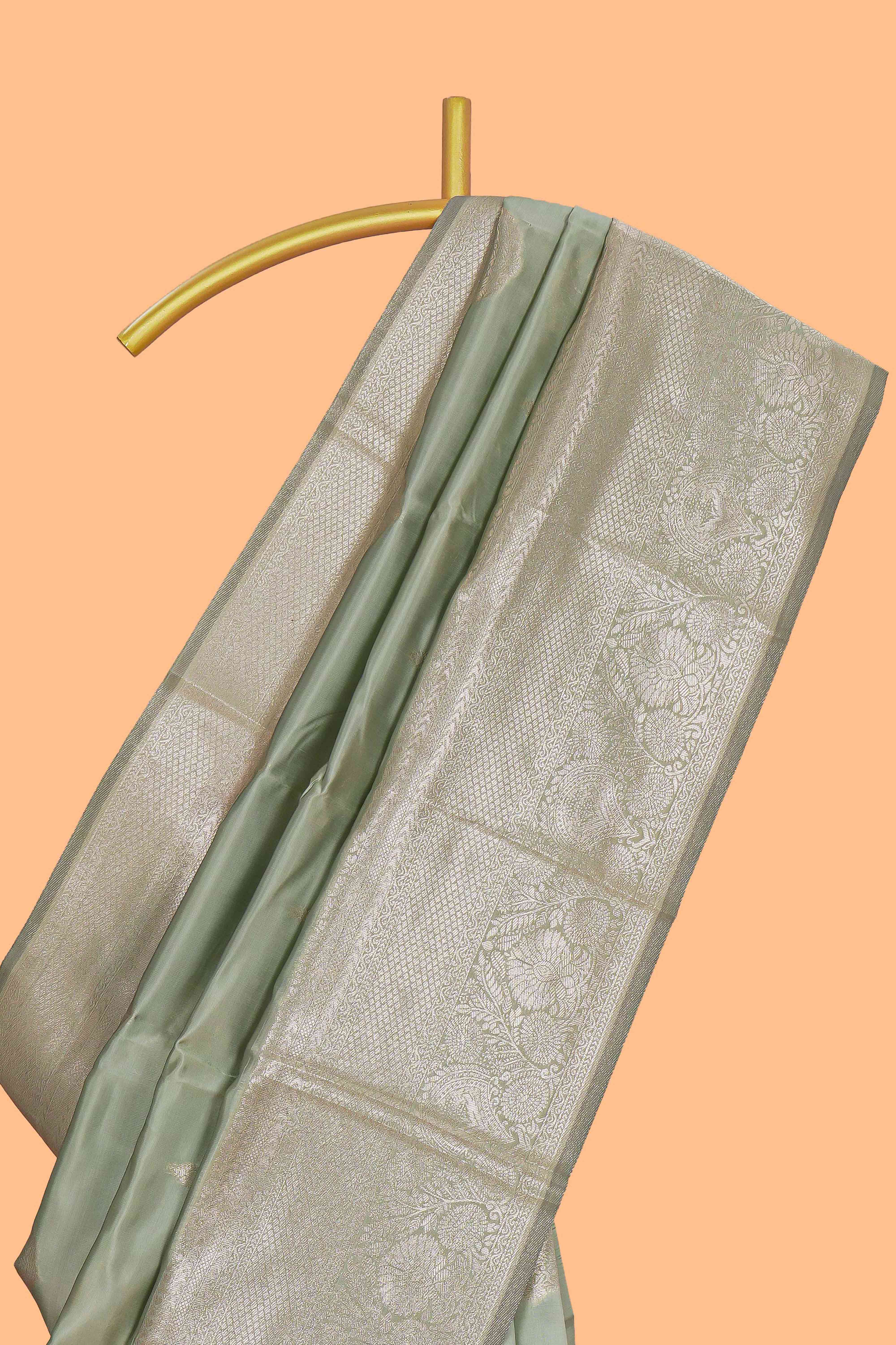 Pista green zari floral motifs art silk saree with self zari border and matching motifs blouse