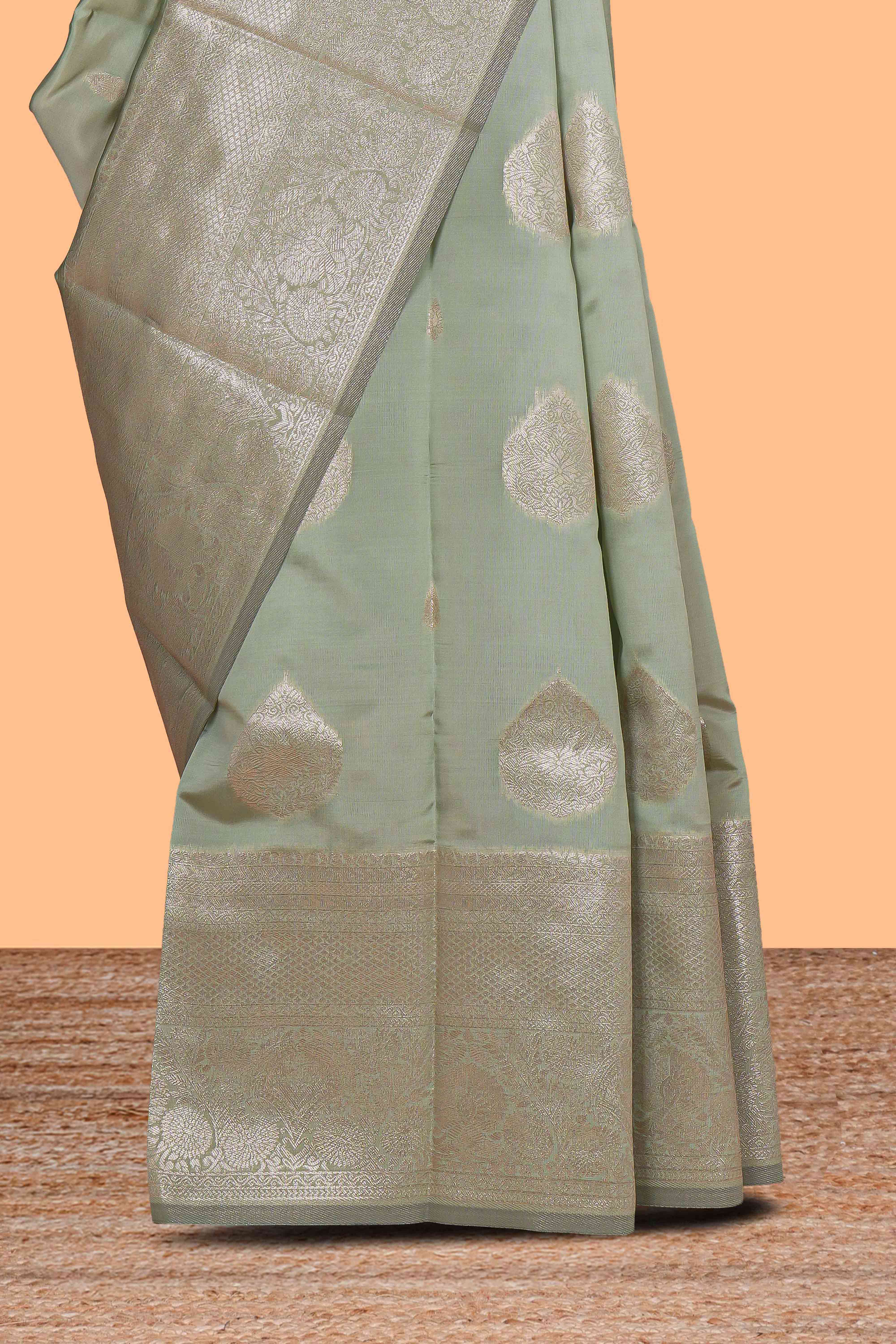 Pista green zari floral motifs art silk saree with self zari border and matching motifs blouse