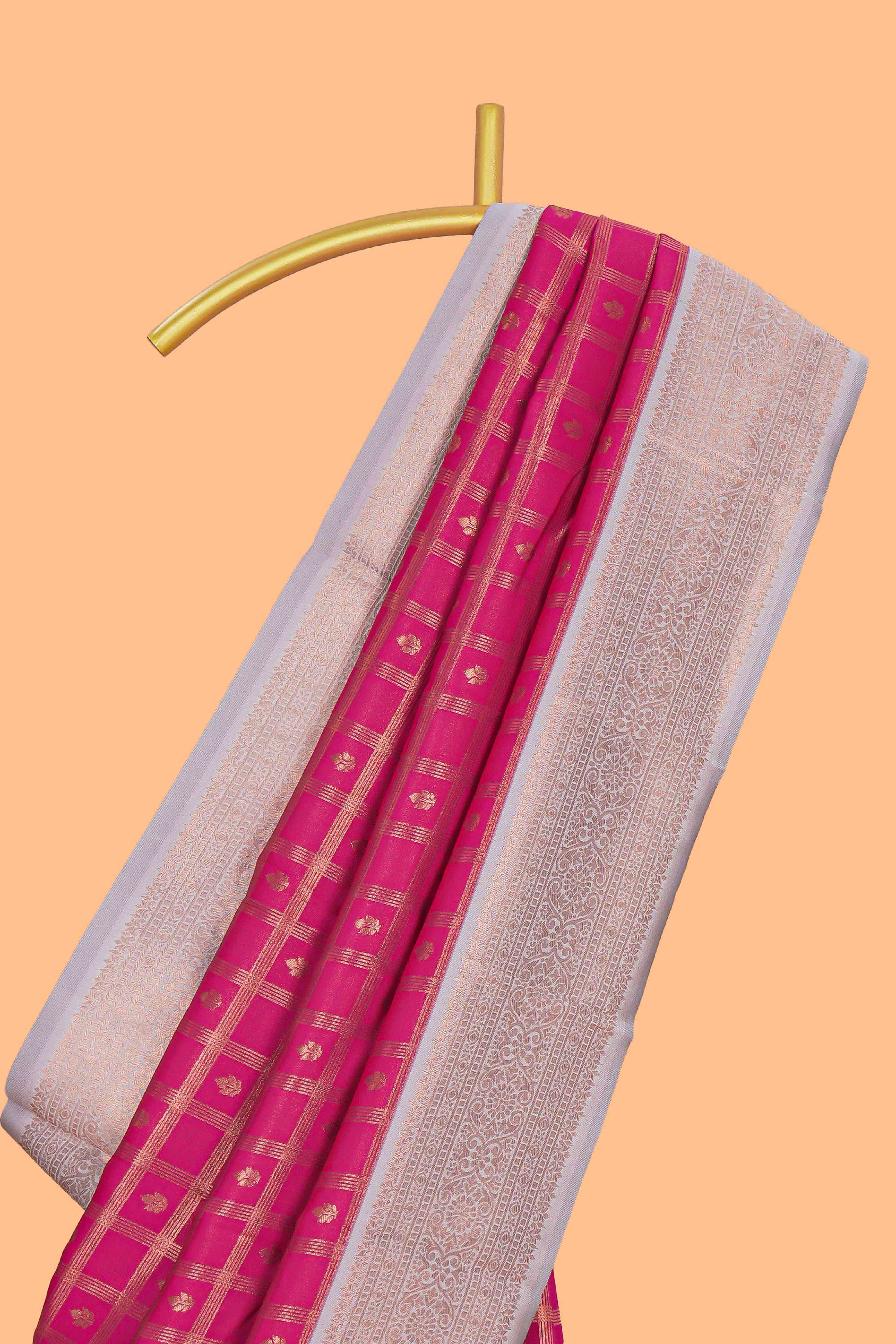 Pink checked zari motifs art silk saree with contrast zari border and contrast motifs blouse