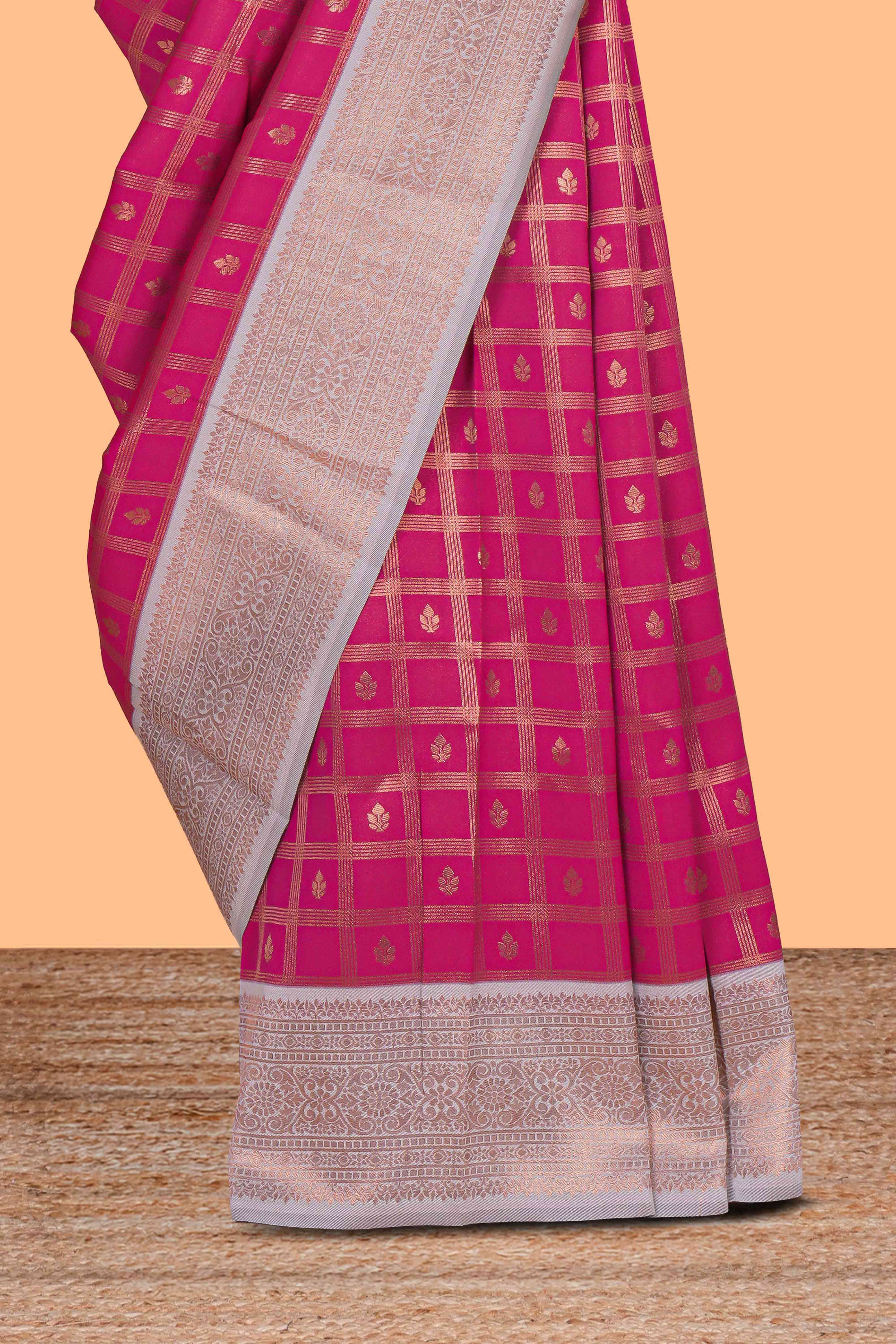 Pink checked zari motifs art silk saree with contrast zari border and contrast motifs blouse