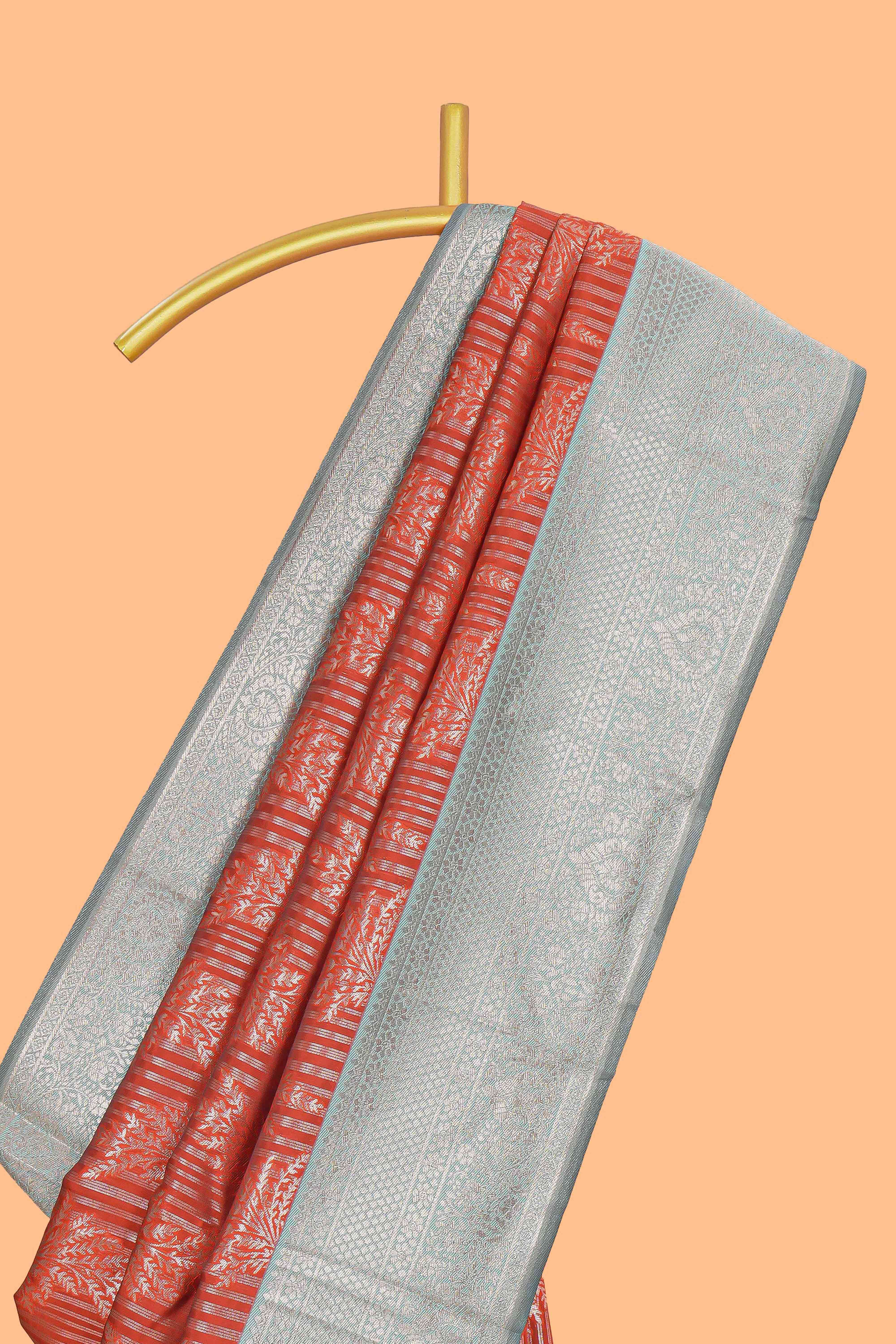 Orange striped floral design art silk saree with contrast zari border and zari motifs blouse