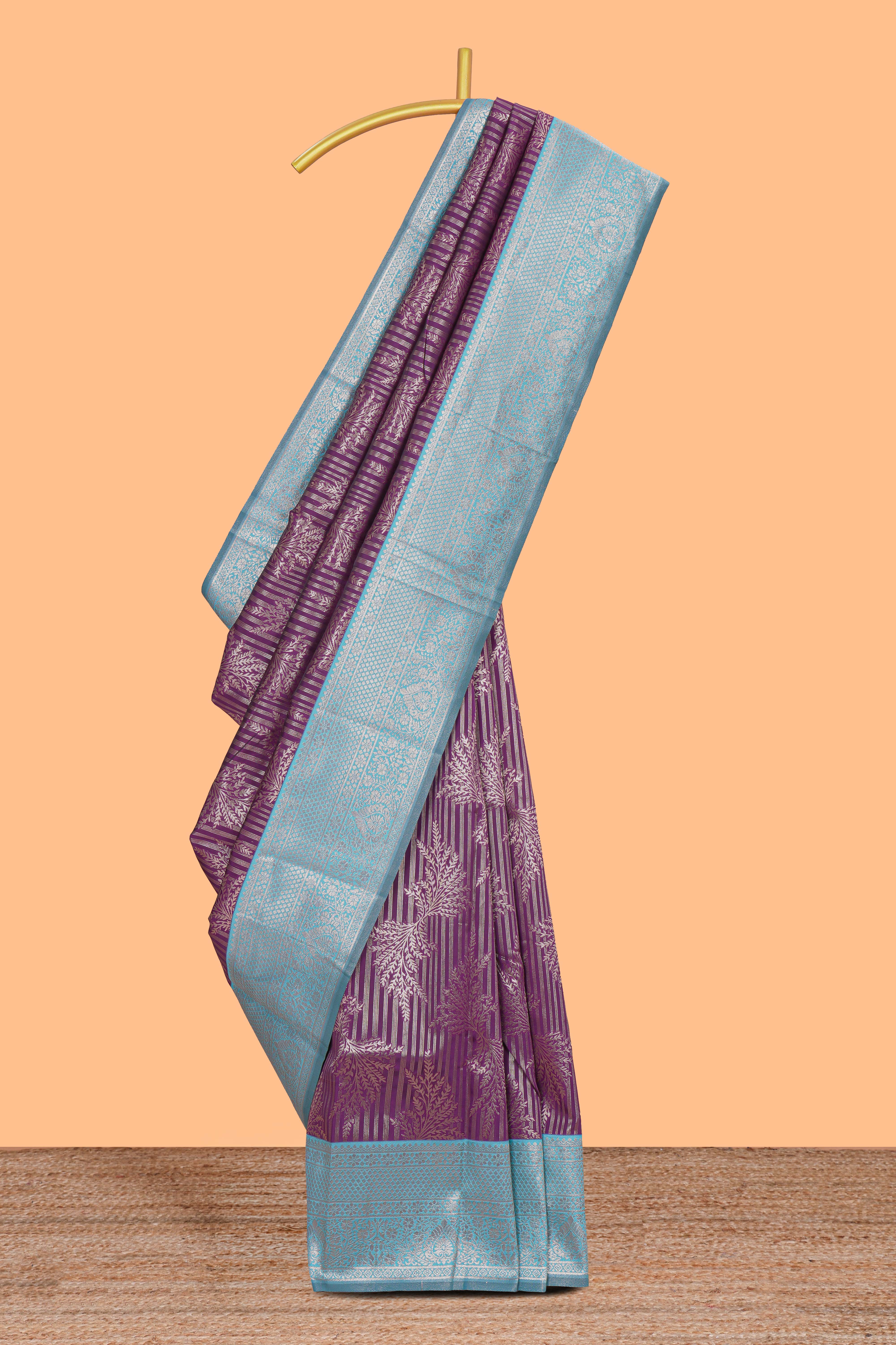 Purple striped floral design art silk saree with contrast zari border and zari motifs blouse