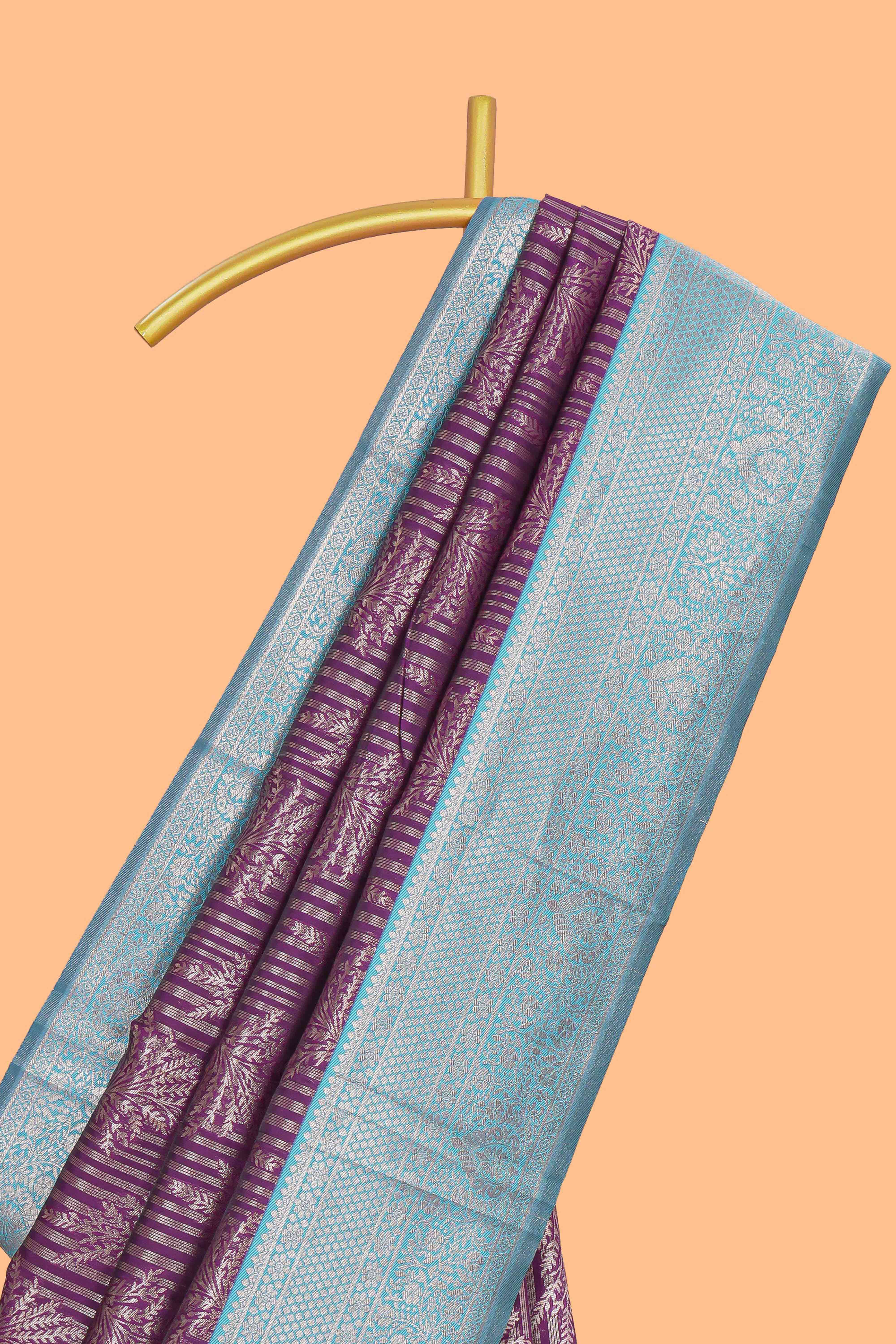 Purple striped floral design art silk saree with contrast zari border and zari motifs blouse