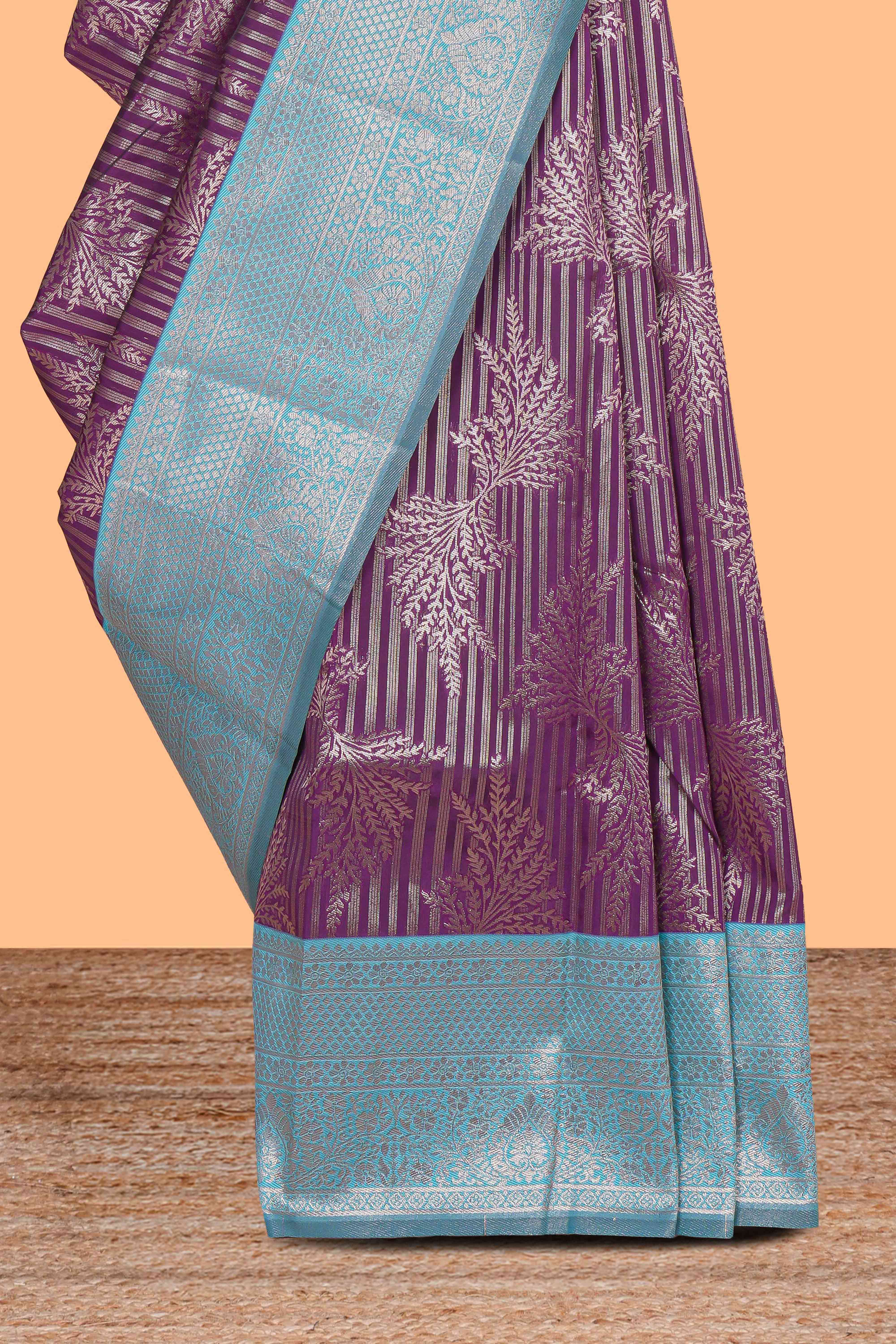 Purple striped floral design art silk saree with contrast zari border and zari motifs blouse