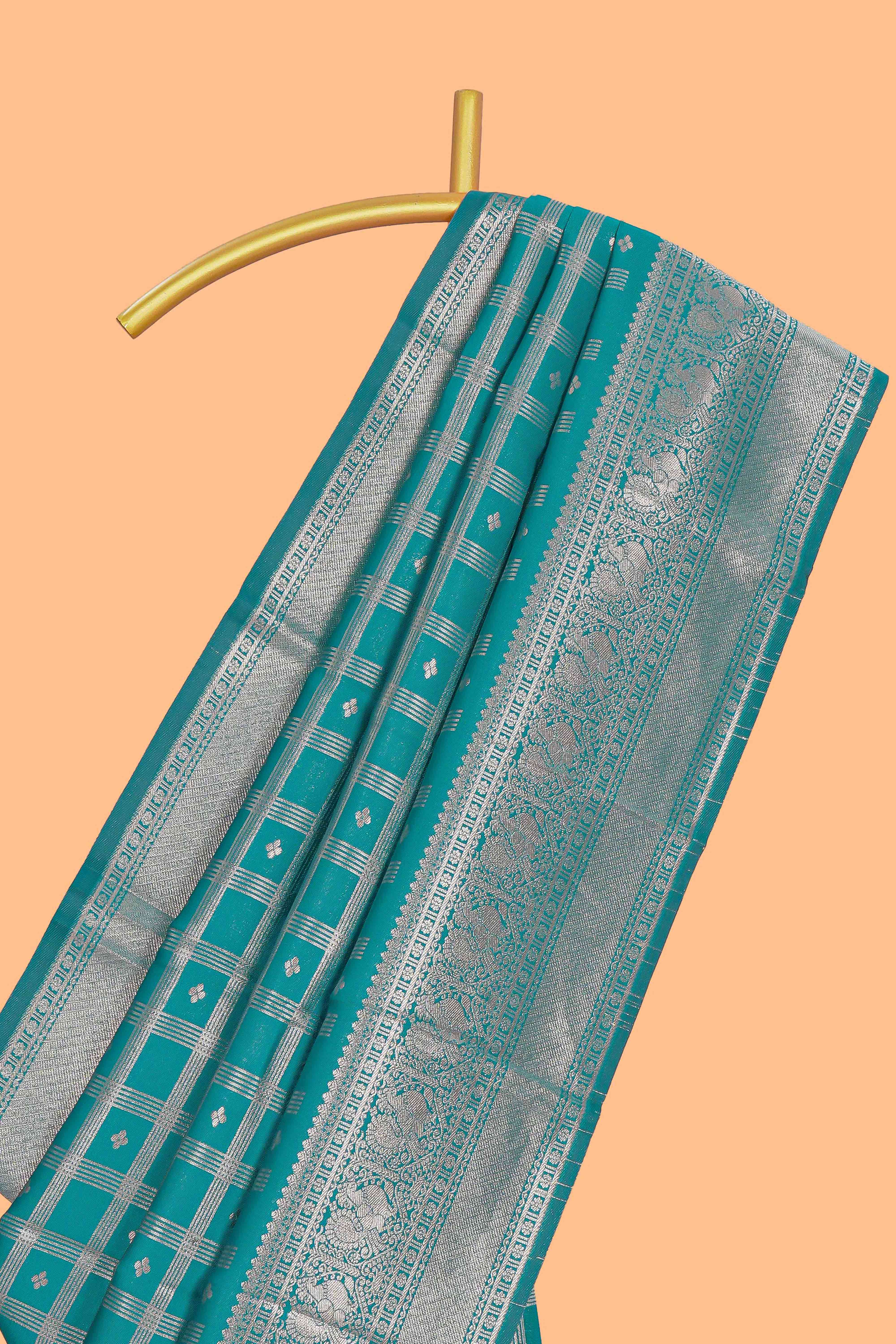 Teal green checked floral motifs design art silk saree with self zari border and matching motifs blouse