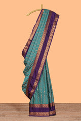 Turquoise green striped zari design art silk saree with contrast zari border and blouse
