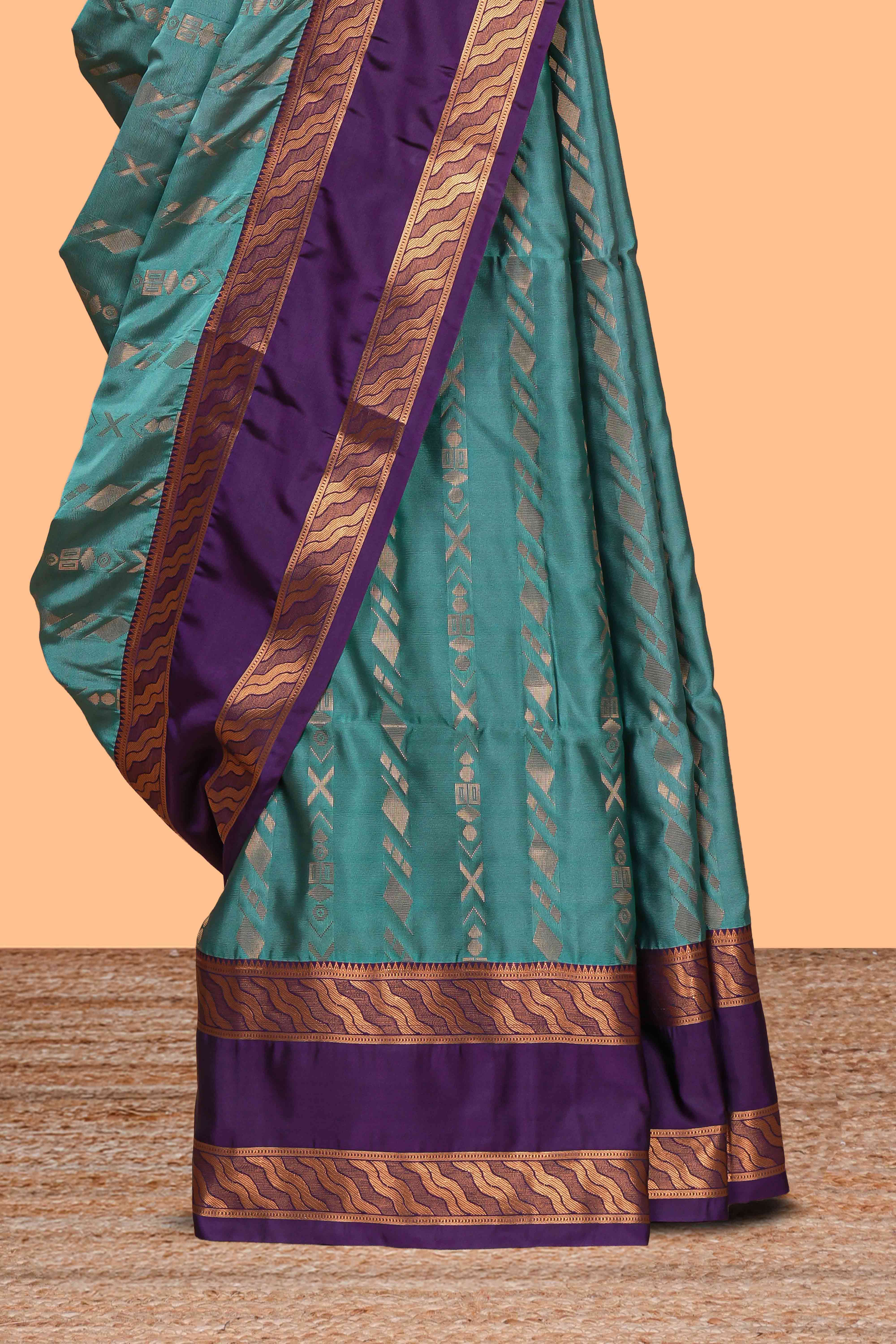 Turquoise green striped zari design art silk saree with contrast zari border and blouse