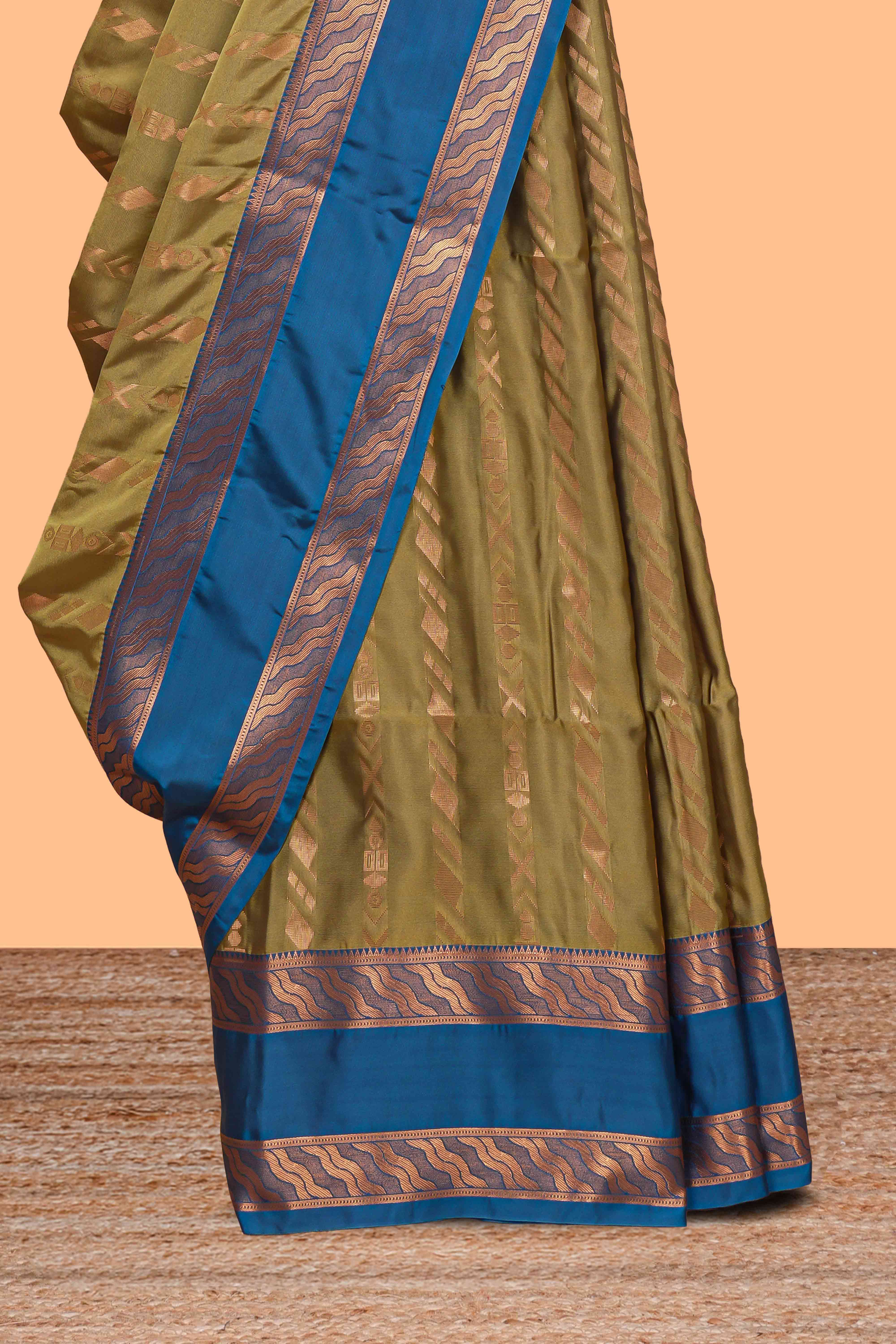 Green striped zari design art silk saree with contrast zari border and blouse
