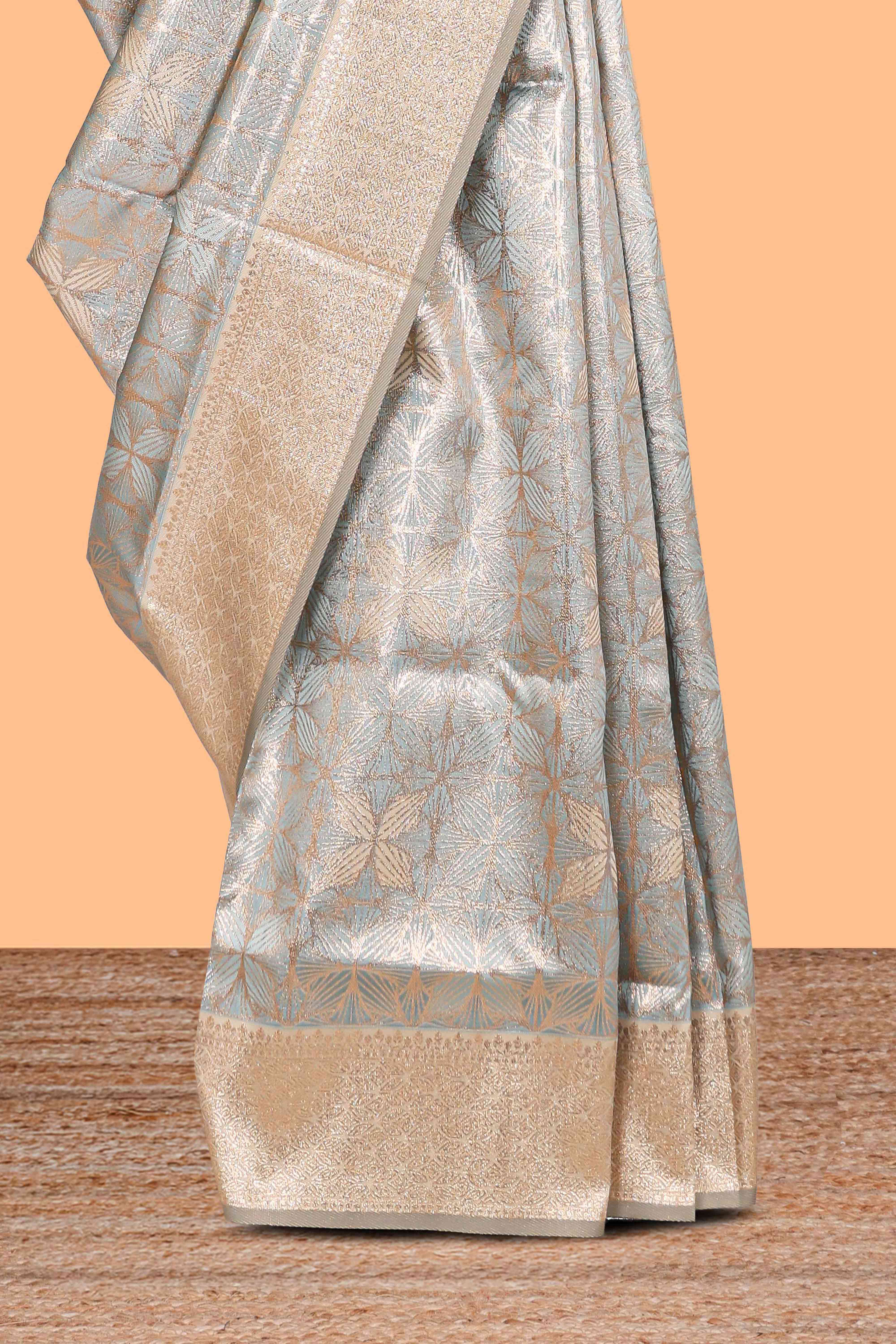 Powder bluegeometric floral design art silk saree with contrast zari border and motifs blouse