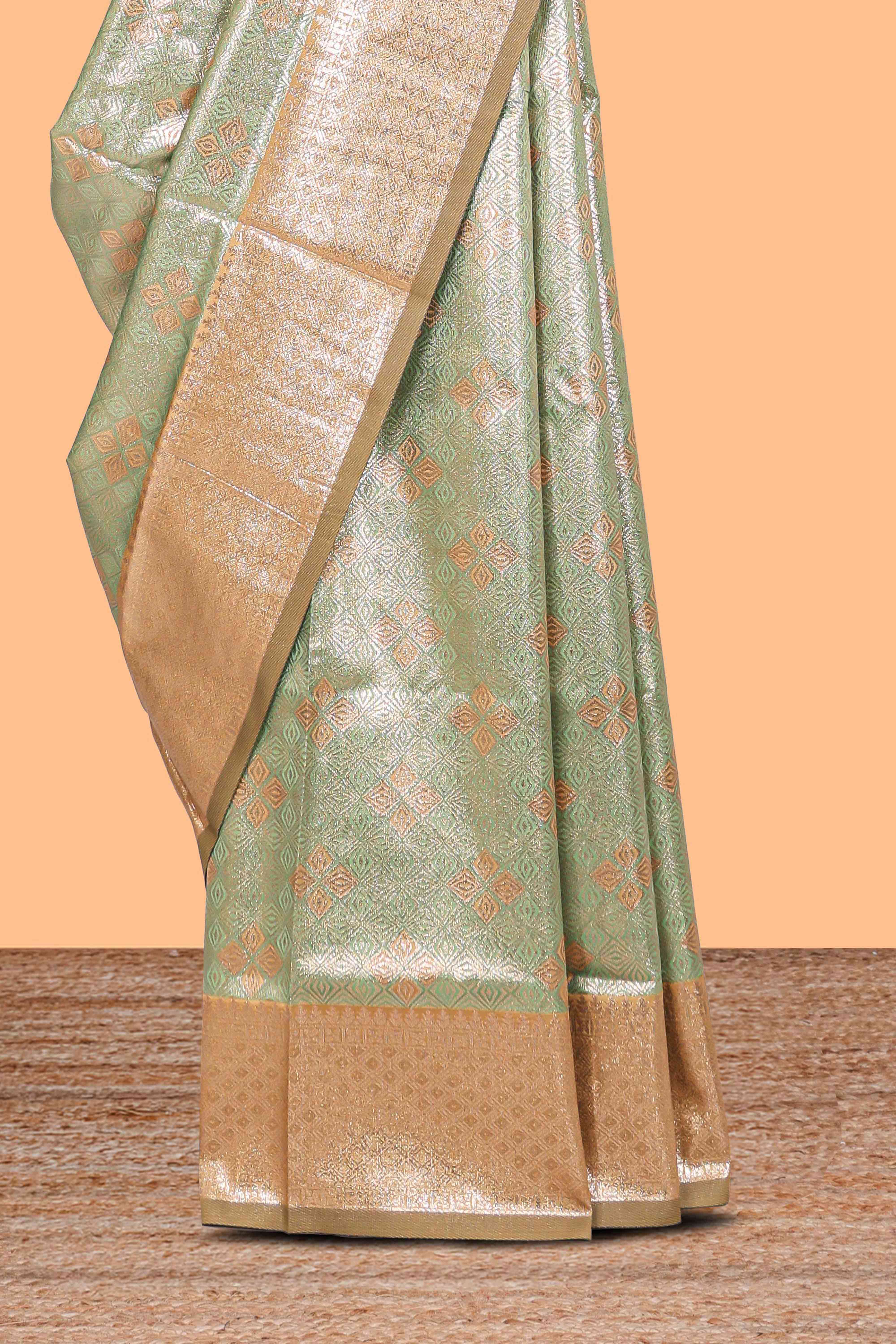 Green floral design art silk saree with contrast zari border and motifs blouse