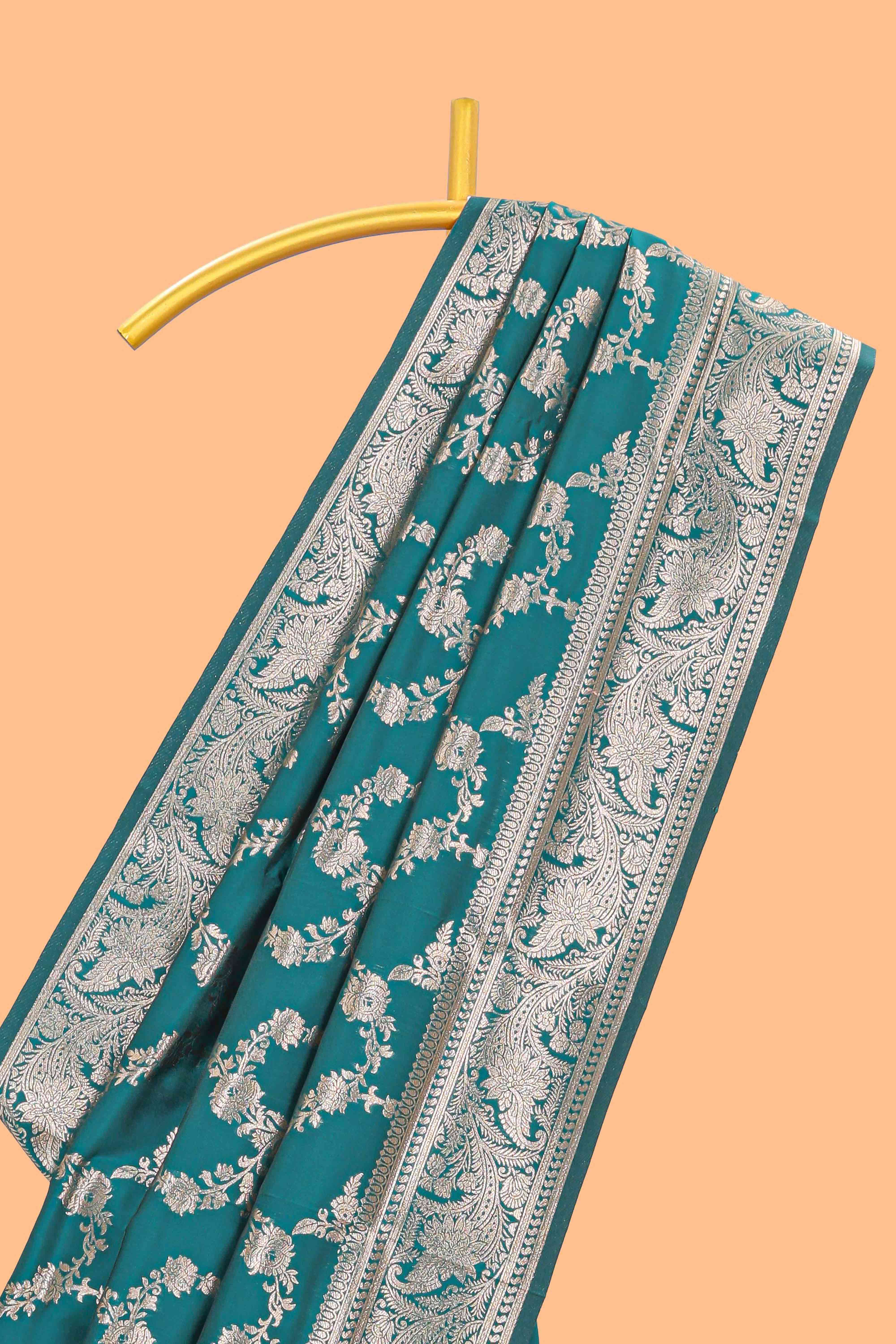 Green floral design art silk saree with self zari border and matching motifs blouse