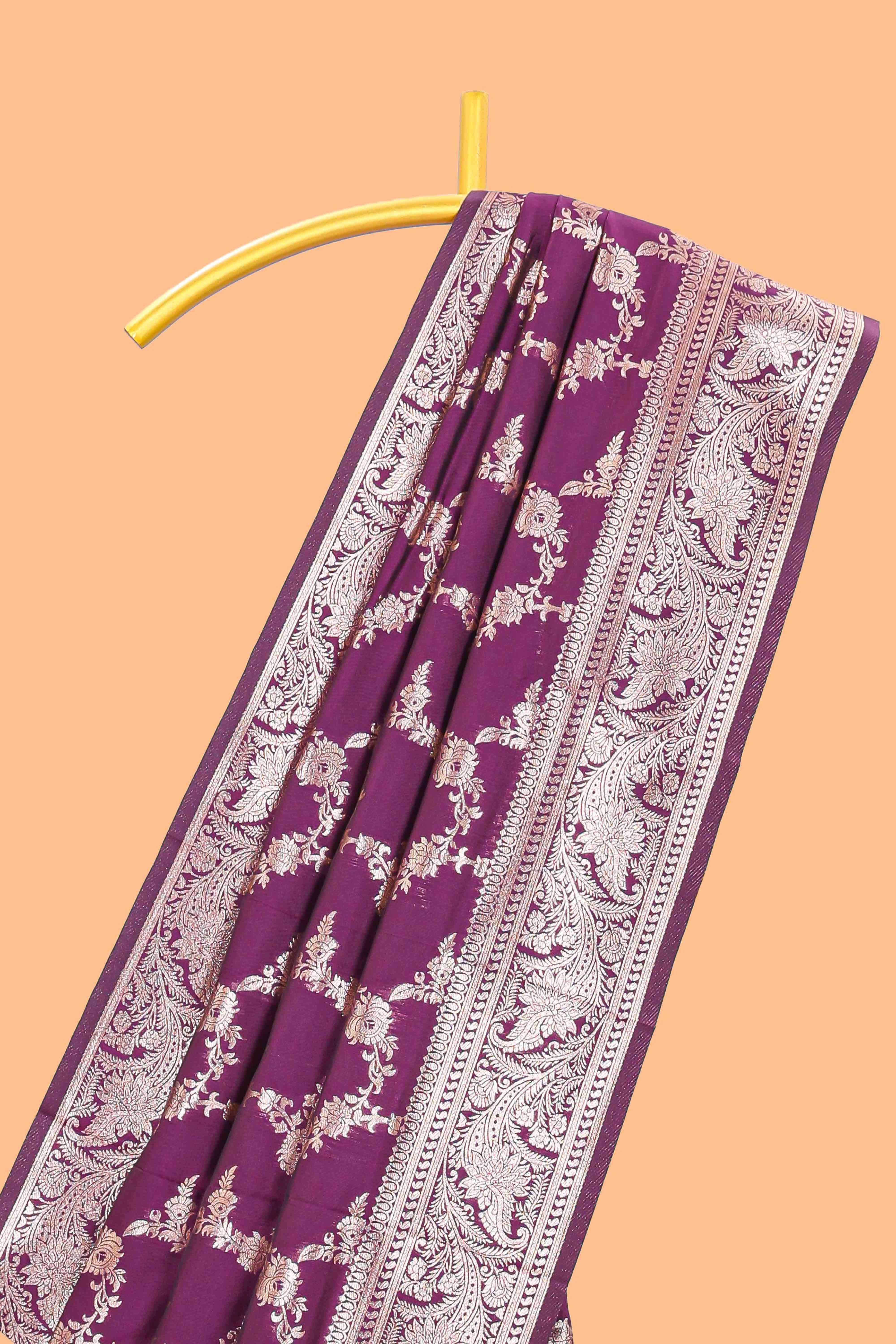 Purple floral design art silk saree with self zari border and matching motifs blouse