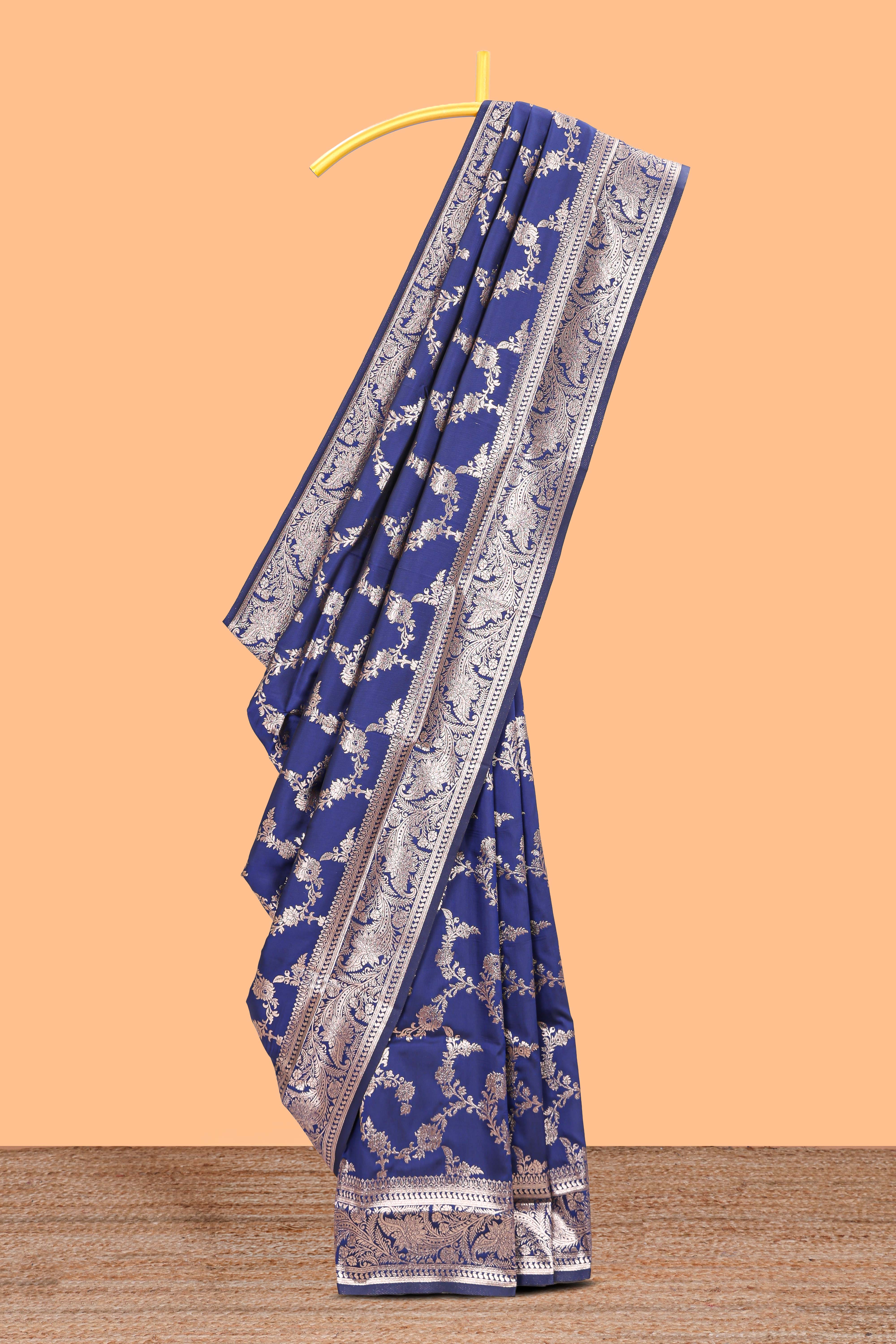 Blue floral design art silk saree with self zari border and matching motifs blouse