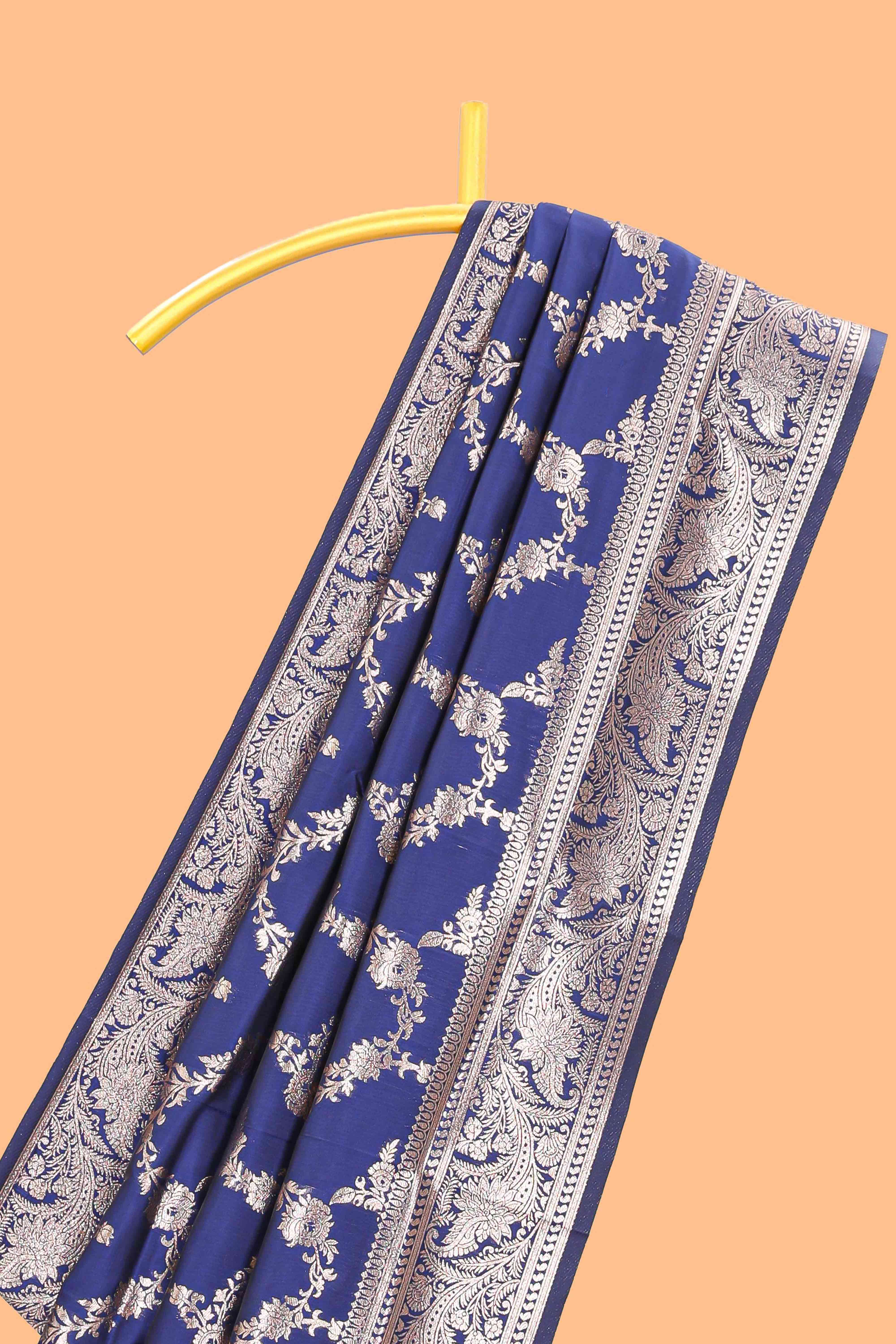 Blue floral design art silk saree with self zari border and matching motifs blouse