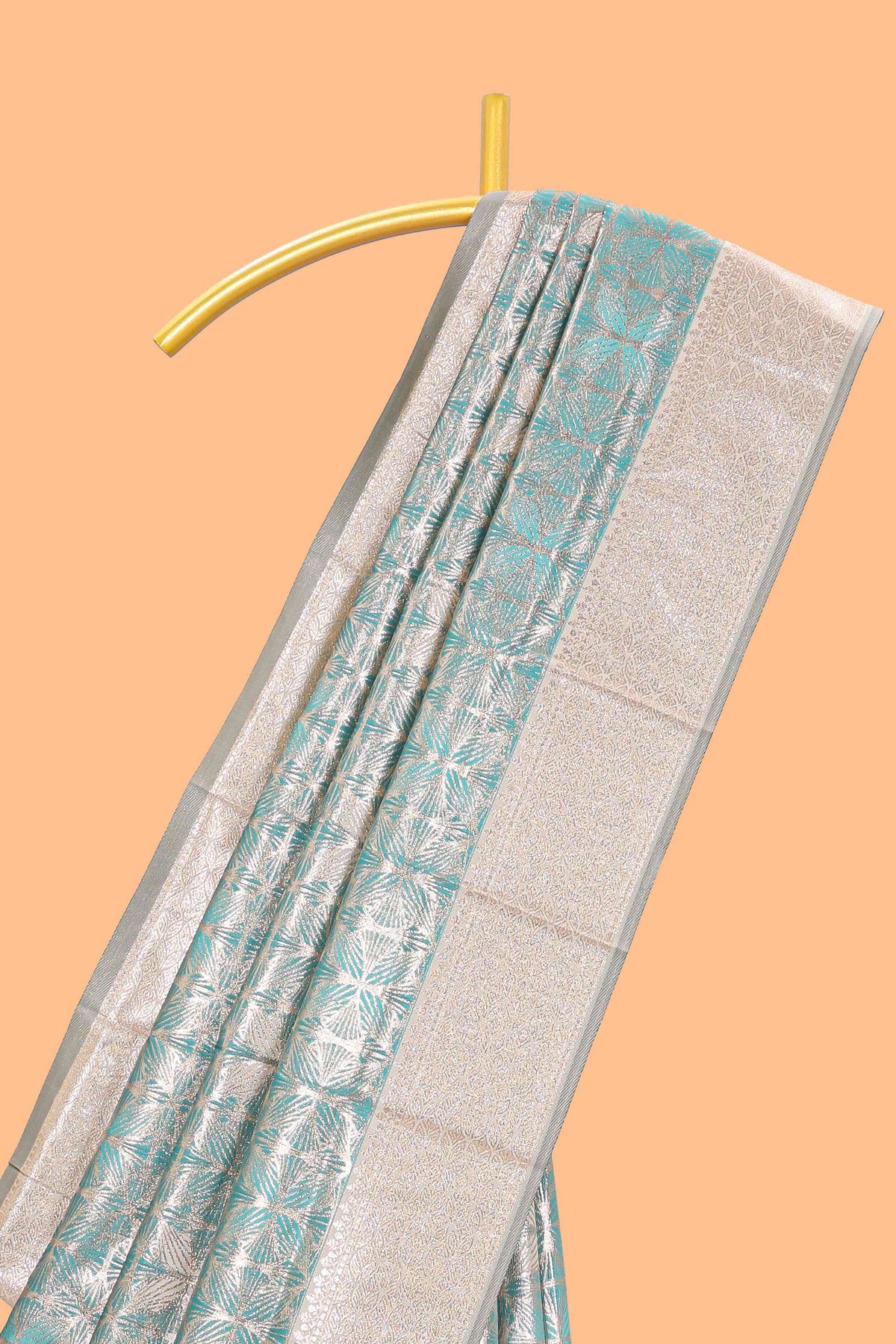 Green geometric floral design art silk saree with contrast zari border and motifs blouse