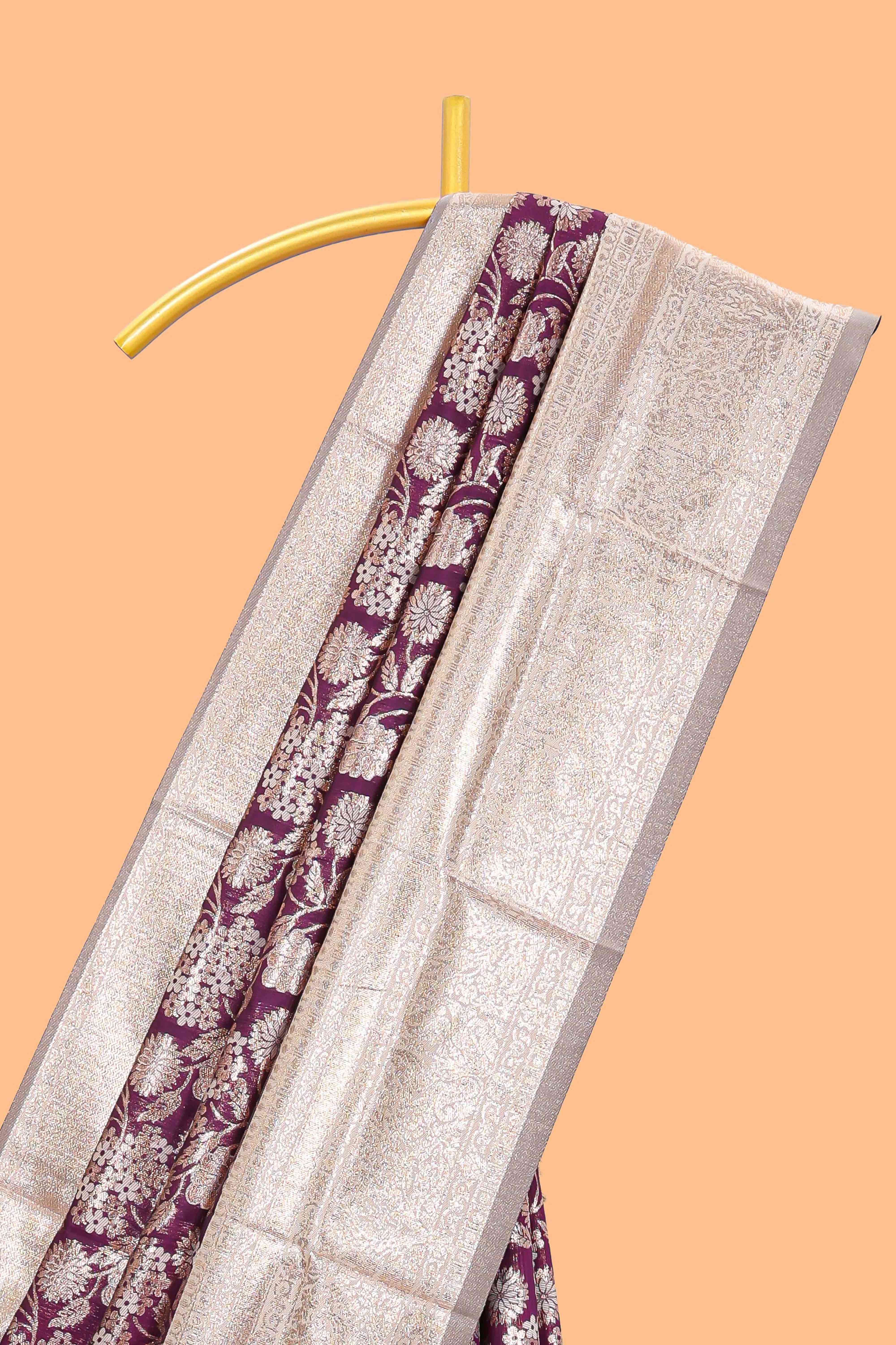Purple floral design art silk saree with contrast zari border and motifs blouse
