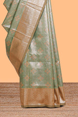 Green motifs design art silk saree with contrast zari border and motifs blouse