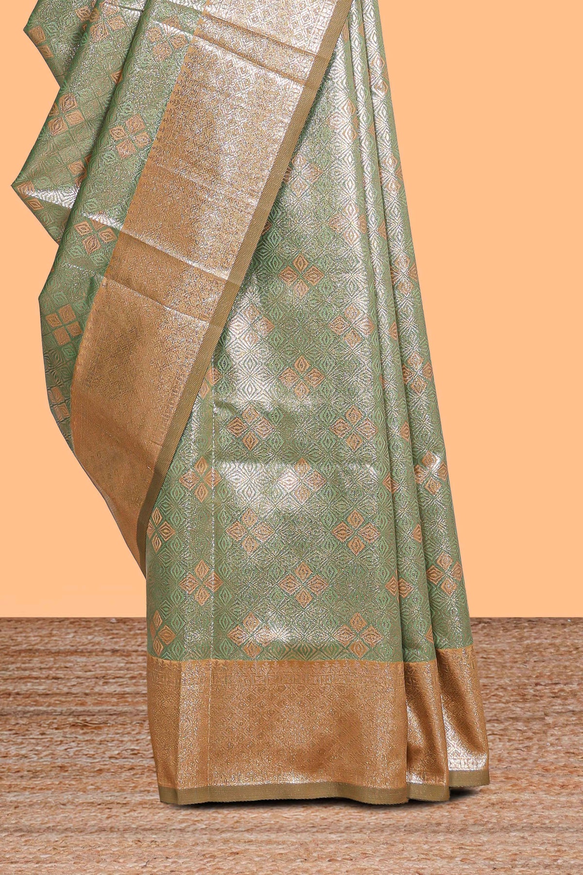 Green motifs design art silk saree with contrast zari border and motifs blouse