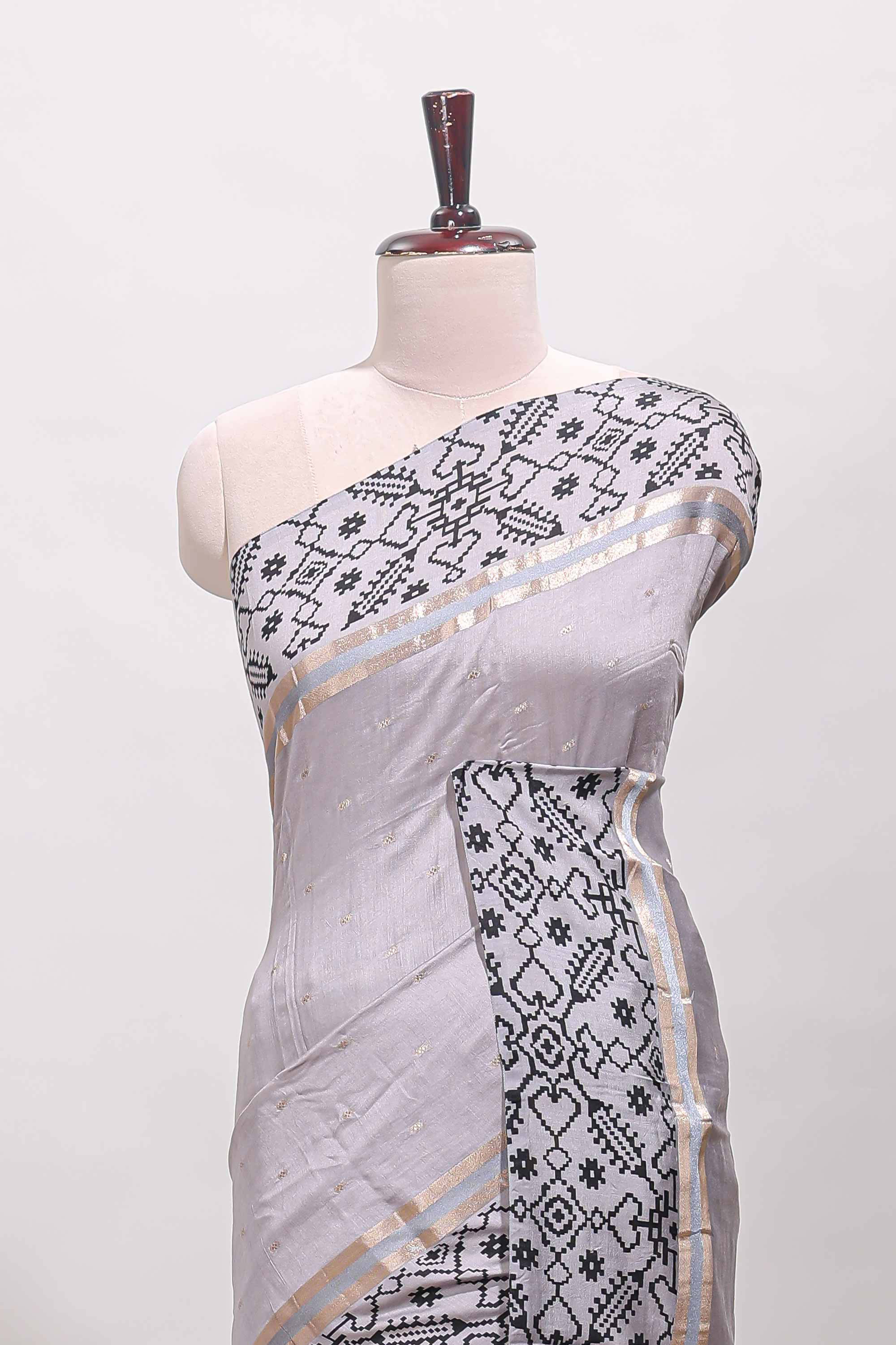 Faded lavender plain assam silk saree eith self ikkat style border and matching blouse
