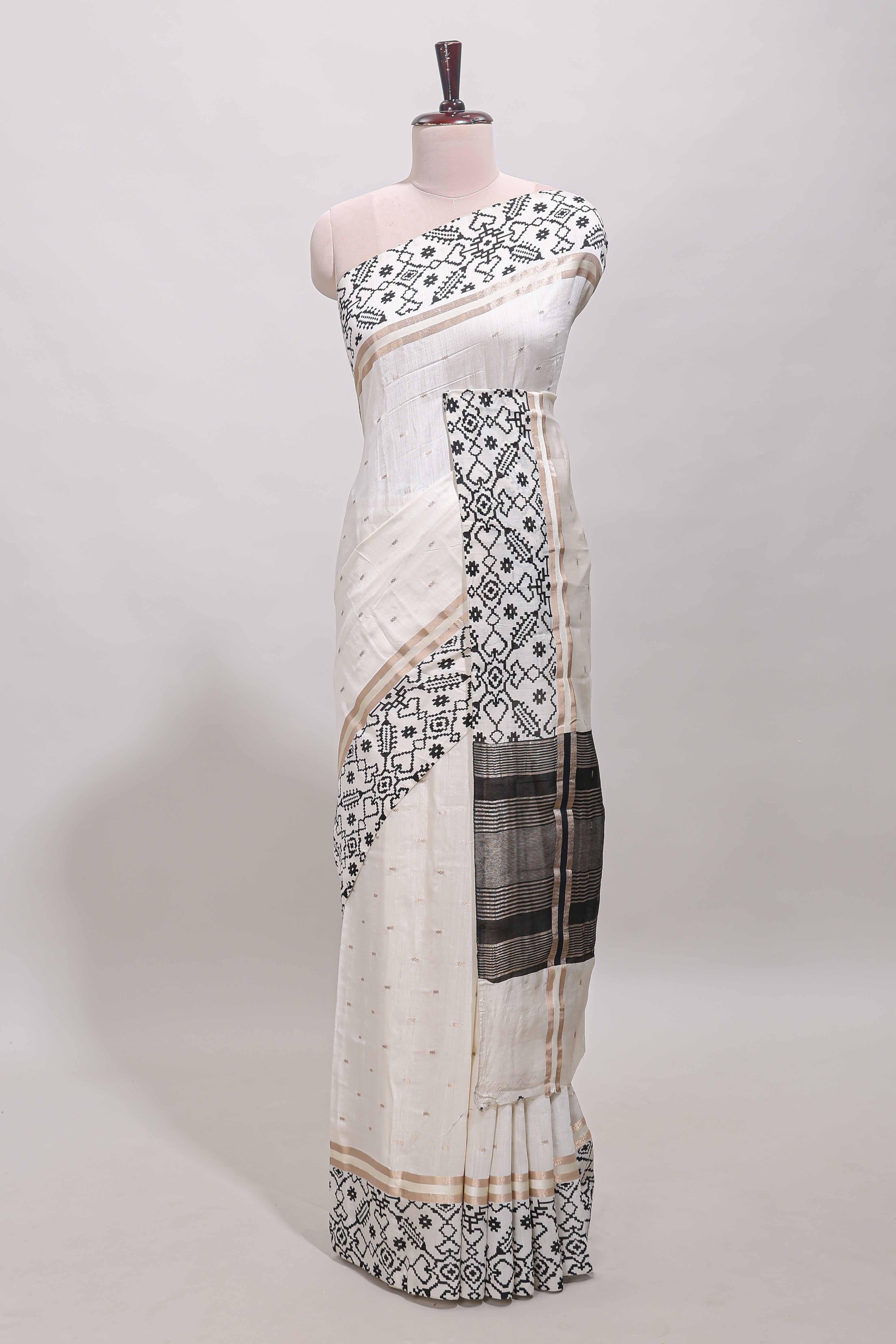 White plain assam silk saree eith self ikkat style border and matching blouse