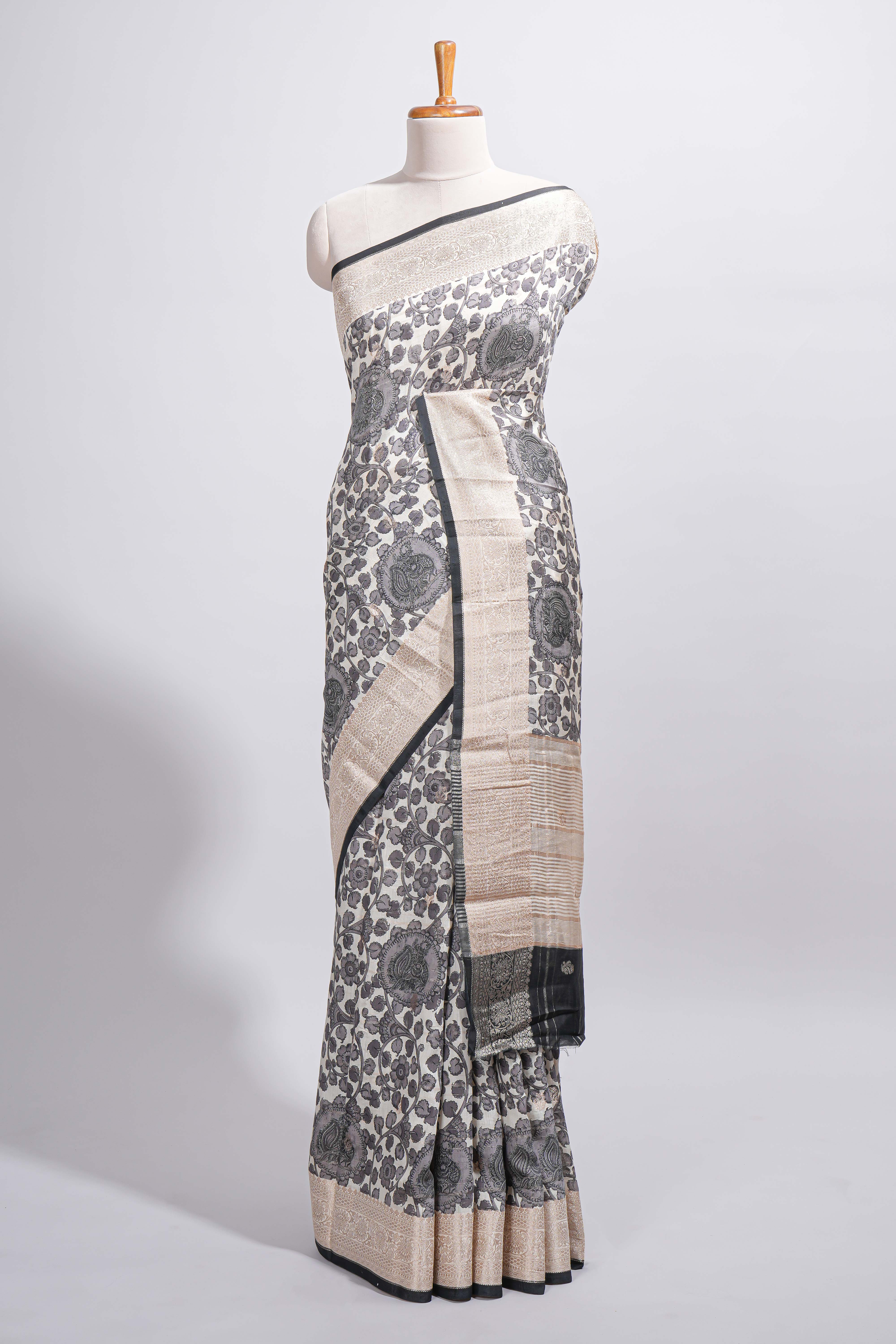 Elegant ivory Assam Silk saree with grey floral motifs detailed zari border and a contrast pallu along with contrast blouse