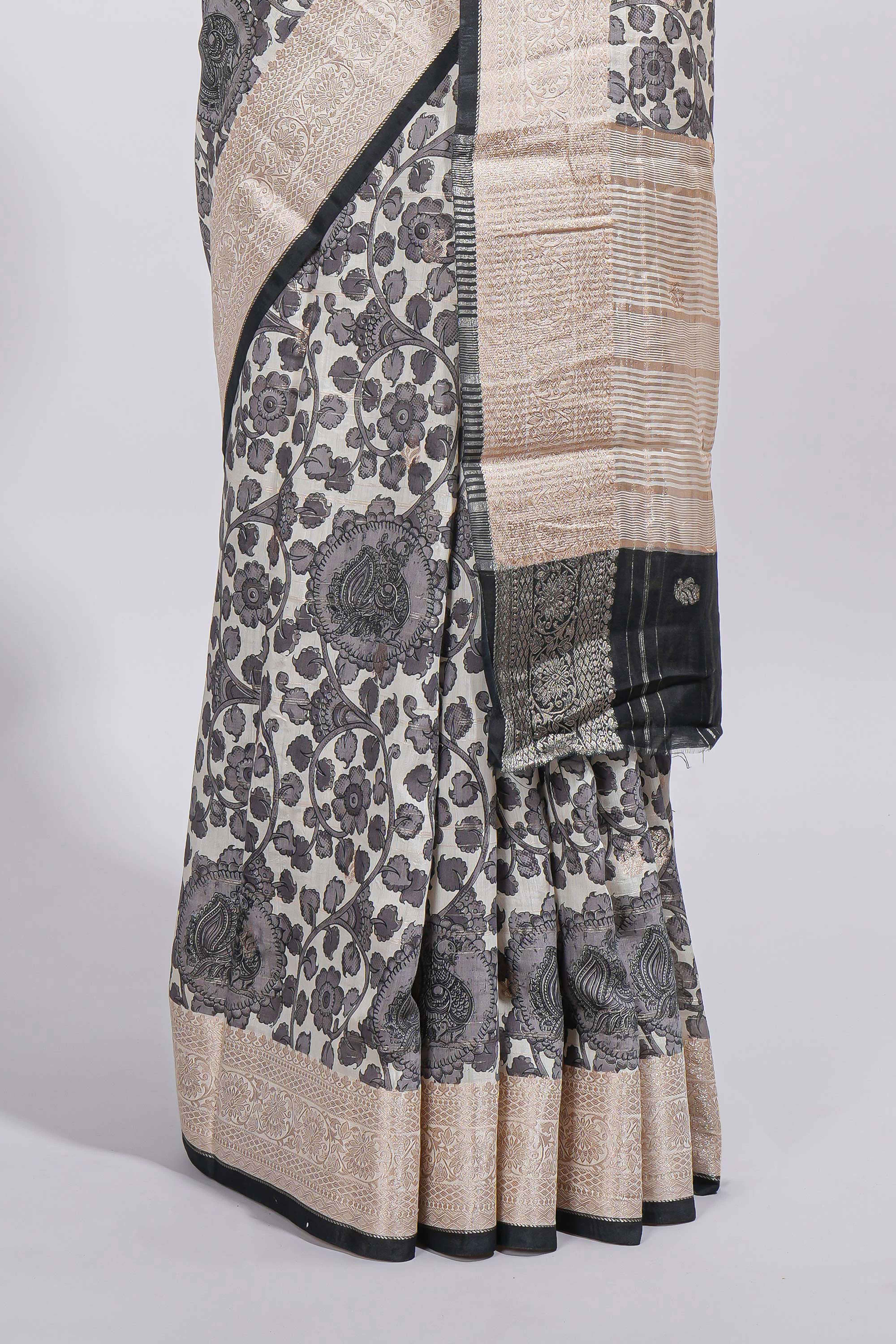 Elegant ivory Assam Silk saree with grey floral motifs detailed zari border and a contrast pallu along with contrast blouse