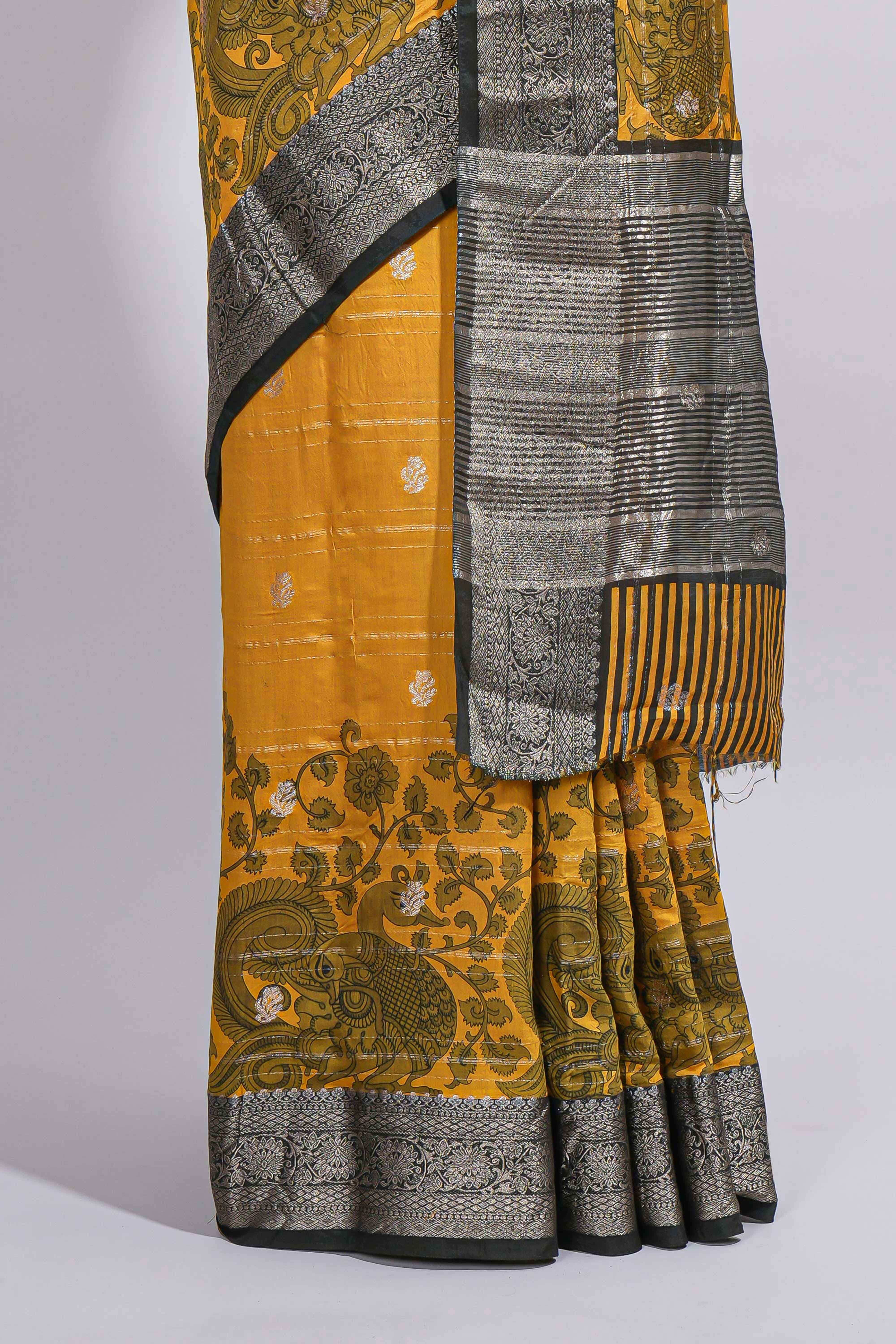 Mustard yellow Assam Silk saree floral and paisley motifs with a rich grey zari border and contrast pallu along with matching blouse