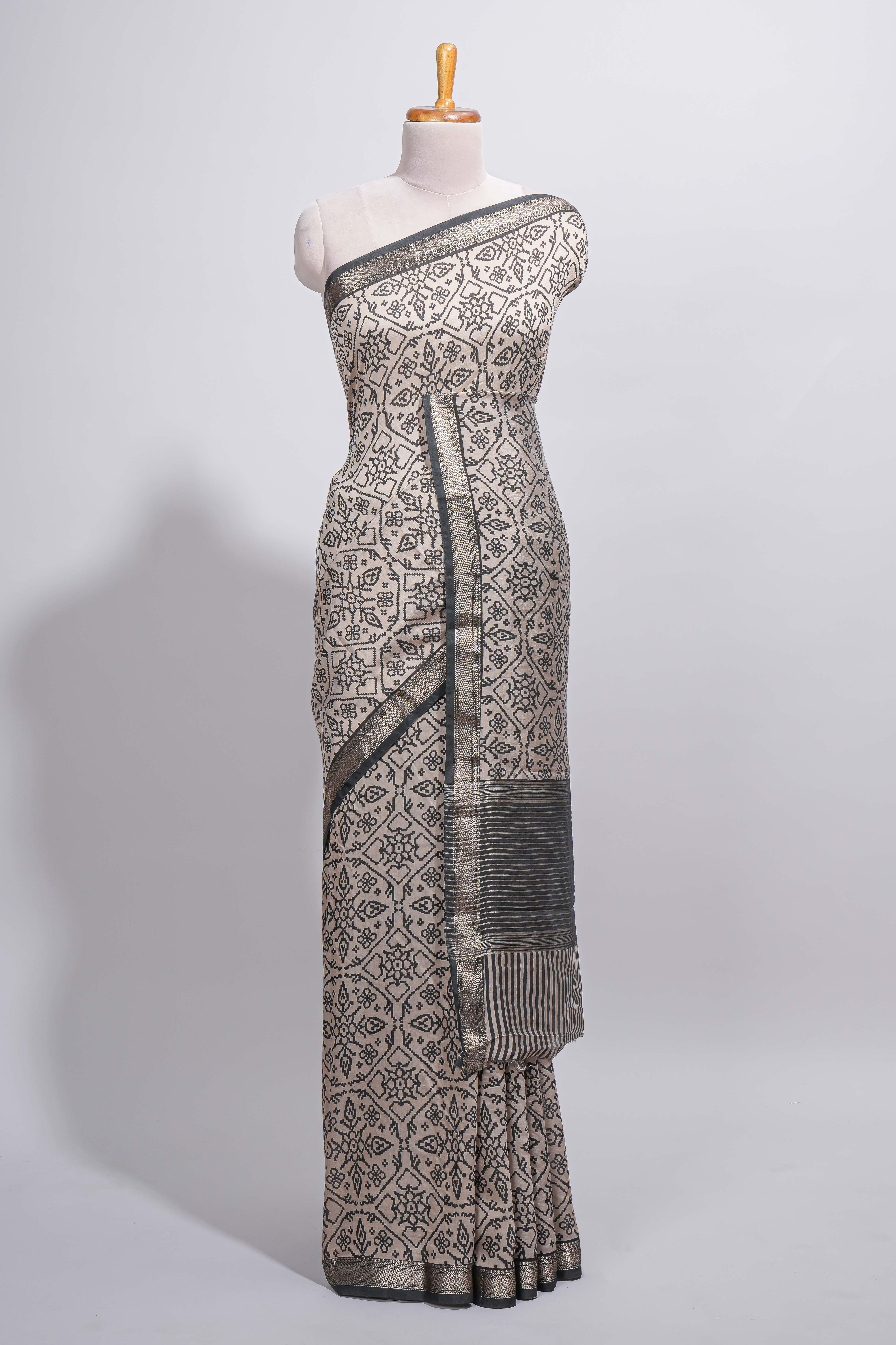 Ivory colour Assam Silk saree traditional folk motif print floral patterns and a contrast woven border The detailed pallu along with contrast blouse