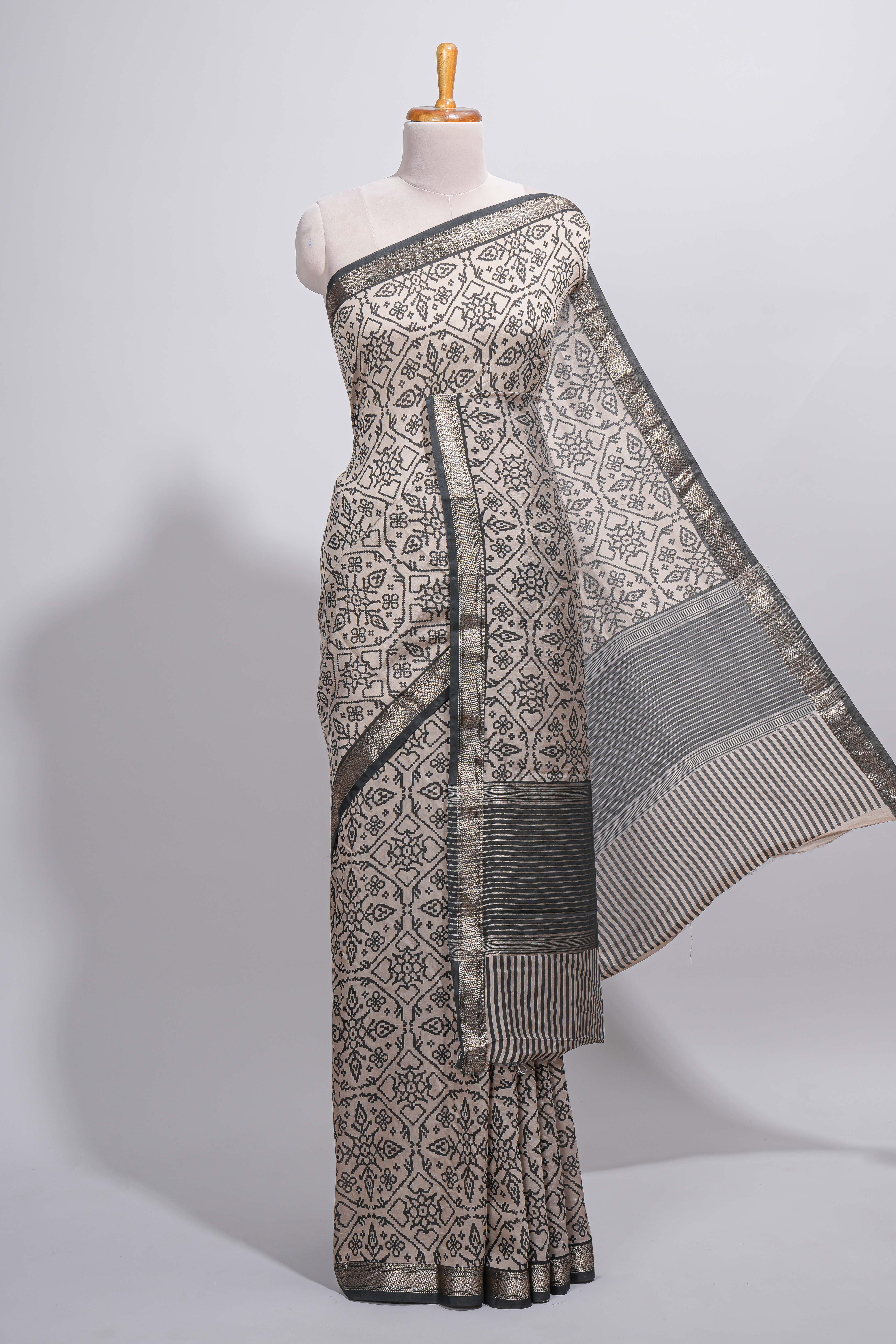 Ivory colour Assam Silk saree traditional folk motif print floral patterns and a contrast woven border The detailed pallu along with contrast blouse