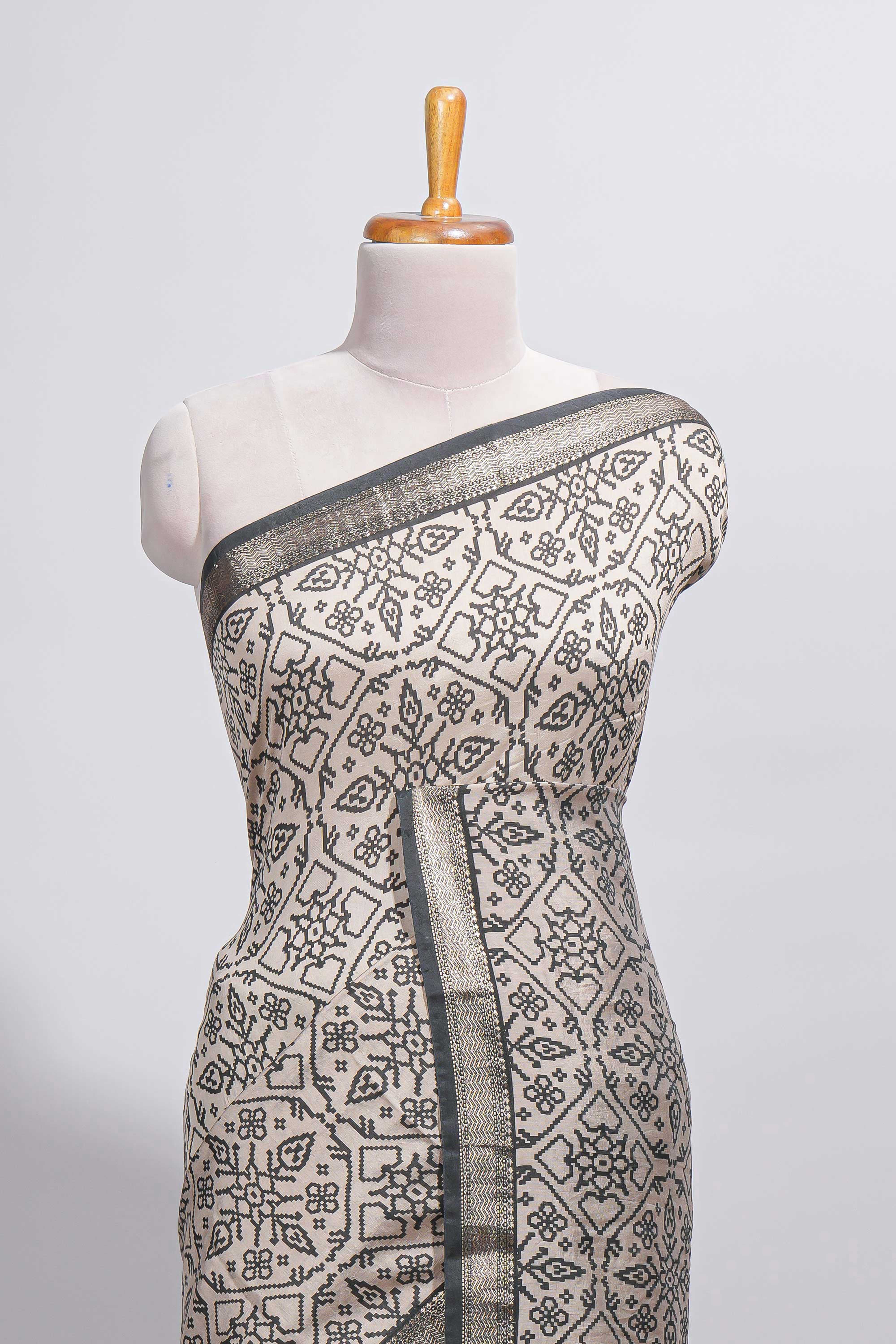 Ivory colour Assam Silk saree traditional folk motif print floral patterns and a contrast woven border The detailed pallu along with contrast blouse