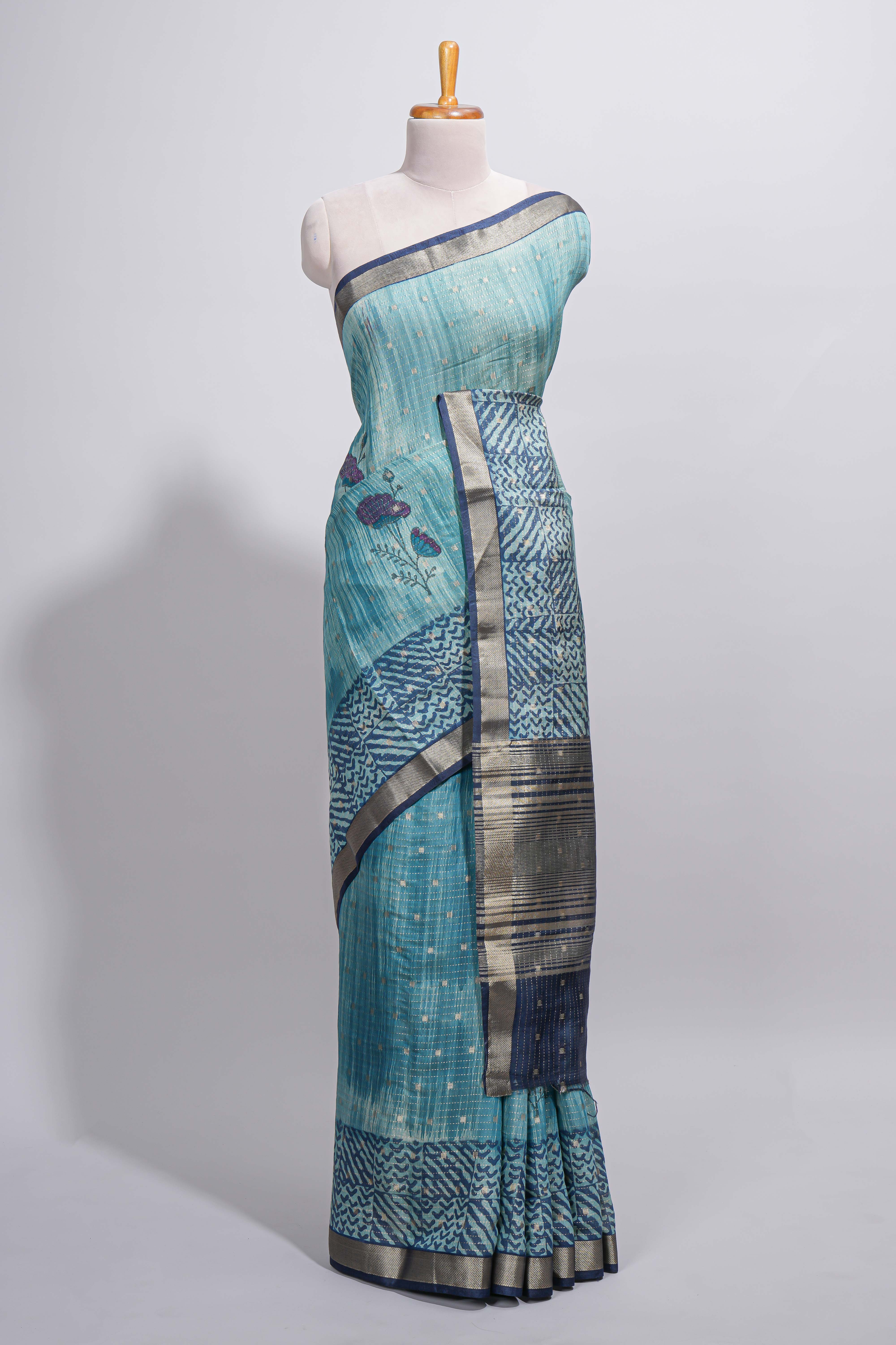 Aqua blue Assam Silk saree with woven patterns floral details contrast navy pallu and zari border along with printed blouse