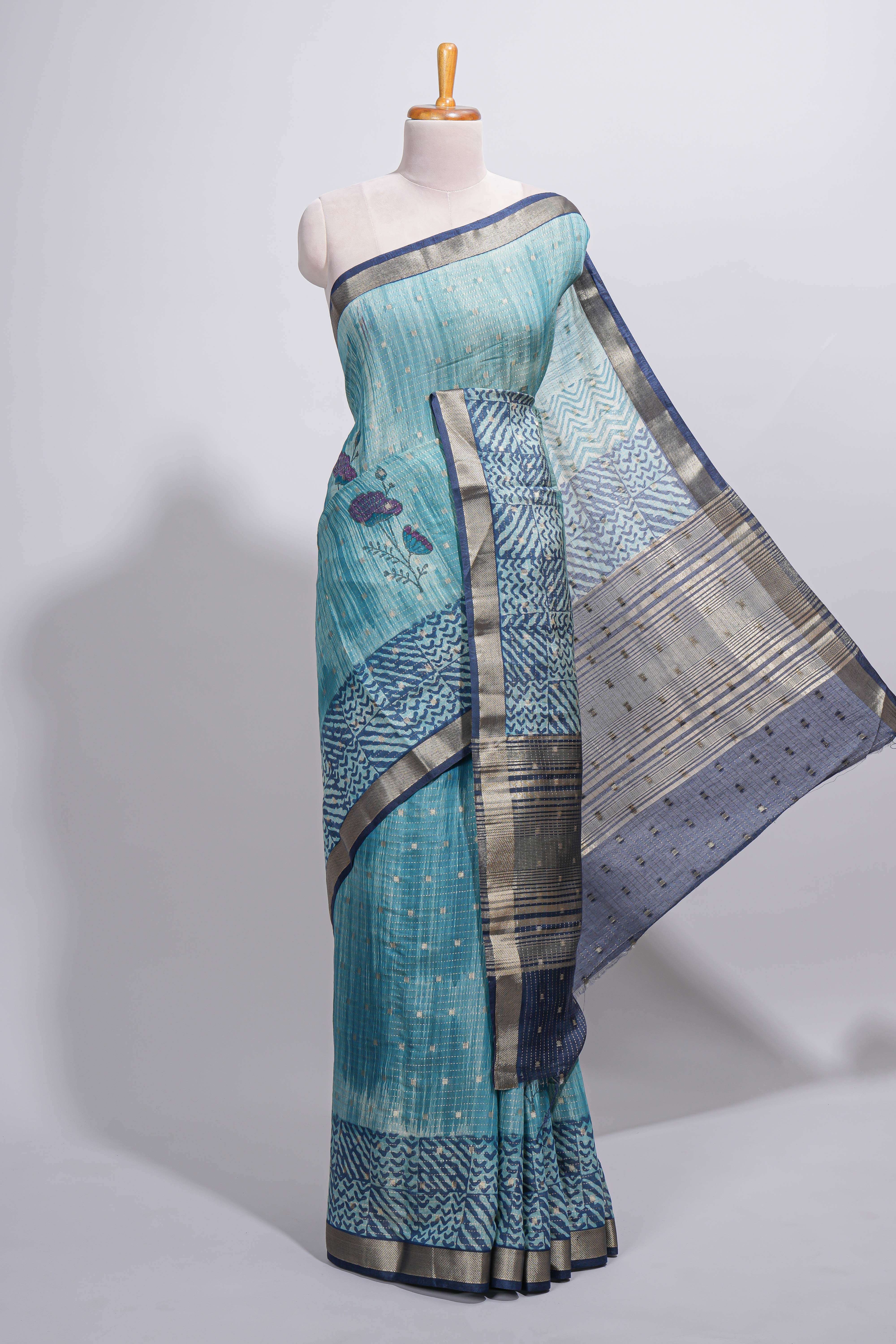 Aqua blue Assam Silk saree with woven patterns floral details contrast navy pallu and zari border along with printed blouse