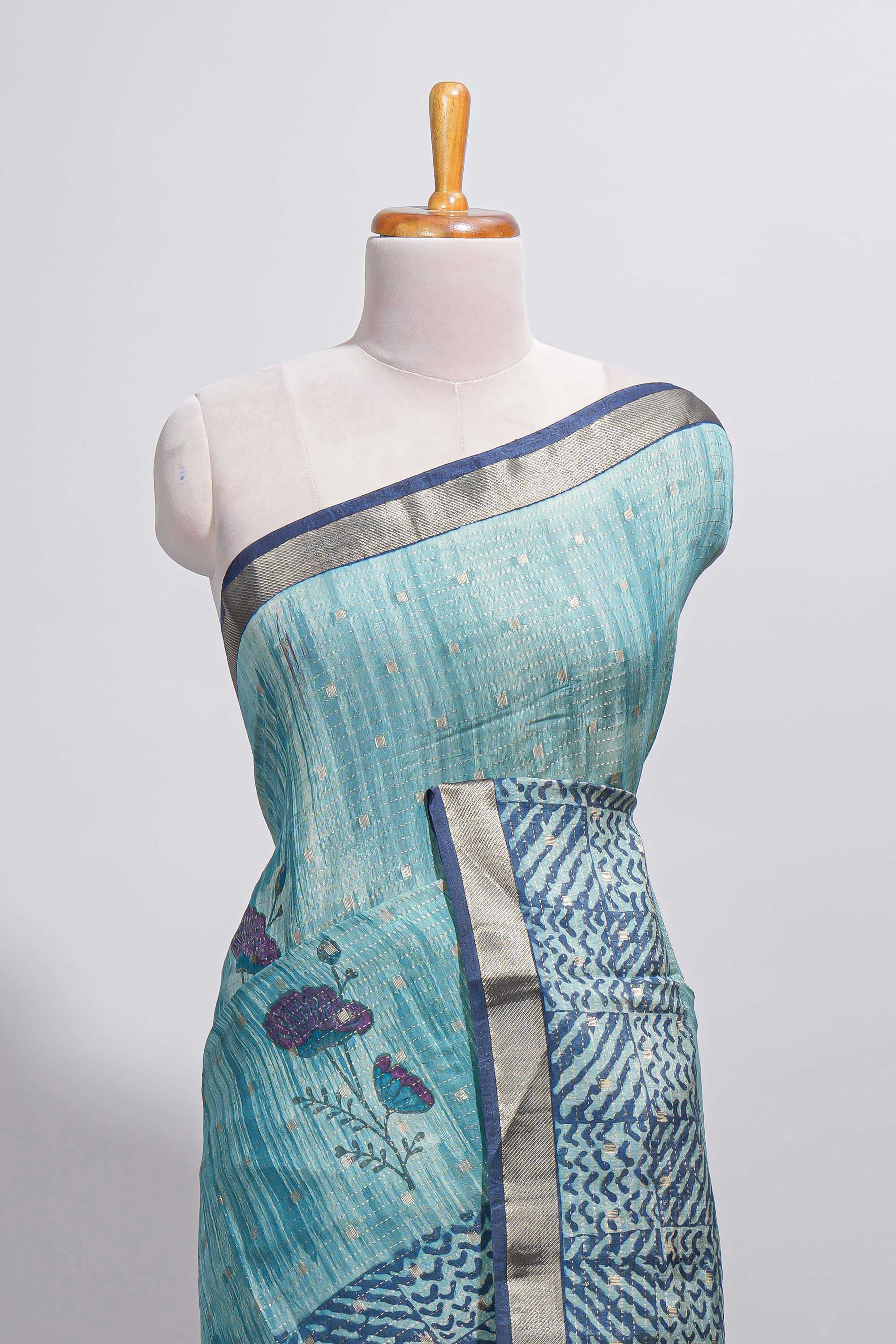 Aqua blue Assam Silk saree with woven patterns floral details contrast navy pallu and zari border along with printed blouse