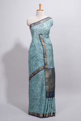 Aqua blue Assam Silk saree with woven patterns floral details contrast navy pallu and zari border along with printed blouse (Copy)
