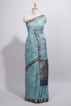 Elegant aqua blue Assam Silk saree abstract floral line motifs subtle woven details contrast pallu and rich zari border and contrast blouse