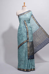 Aqua blue Assam Silk saree with woven patterns floral details contrast navy pallu and zari border along with printed blouse (Copy)