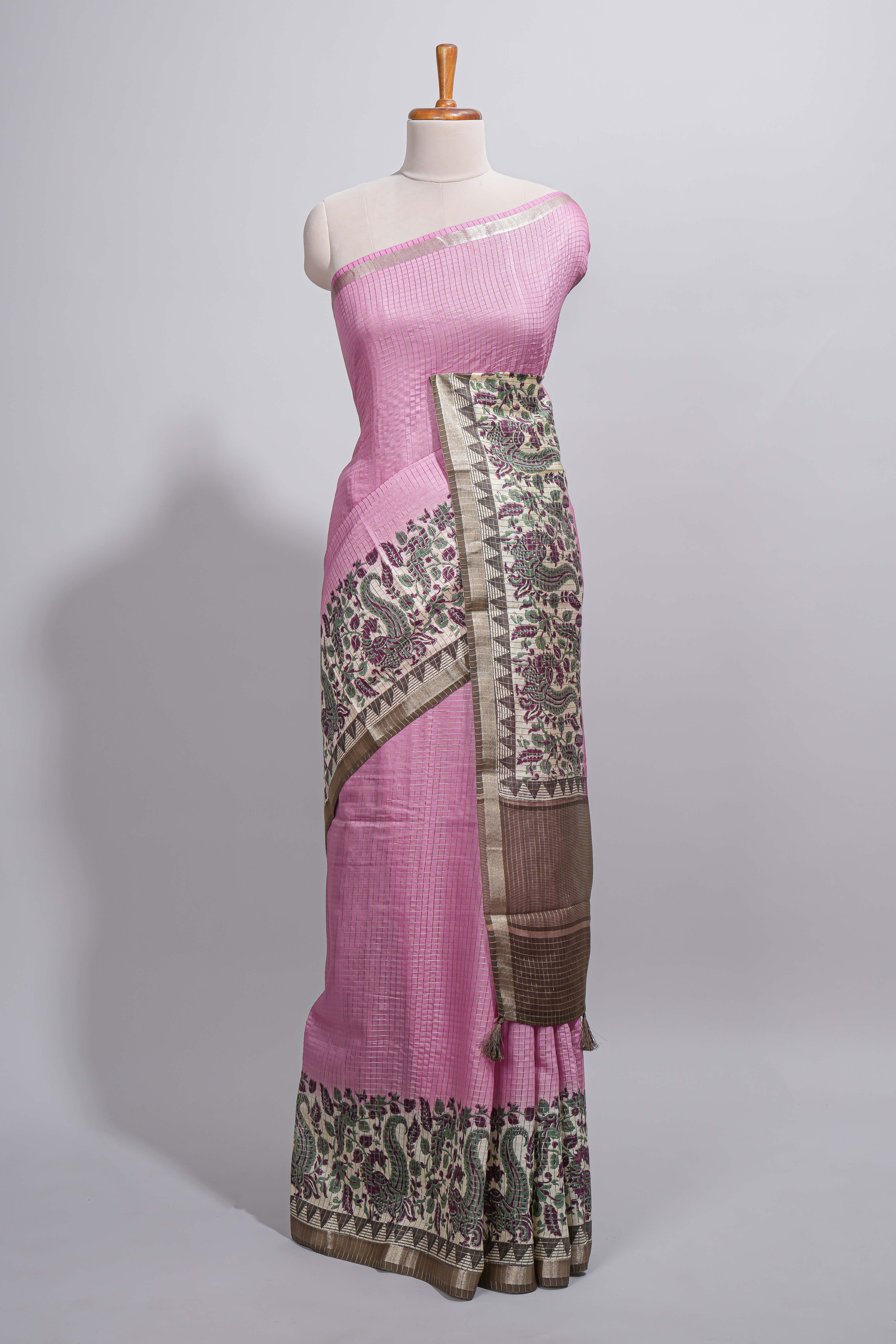 Elegant pastel pink Assam Silk saree withfloral woven motifs rich zari border and contrastpallu with fine stripes and tassel detailing along with blouse piece